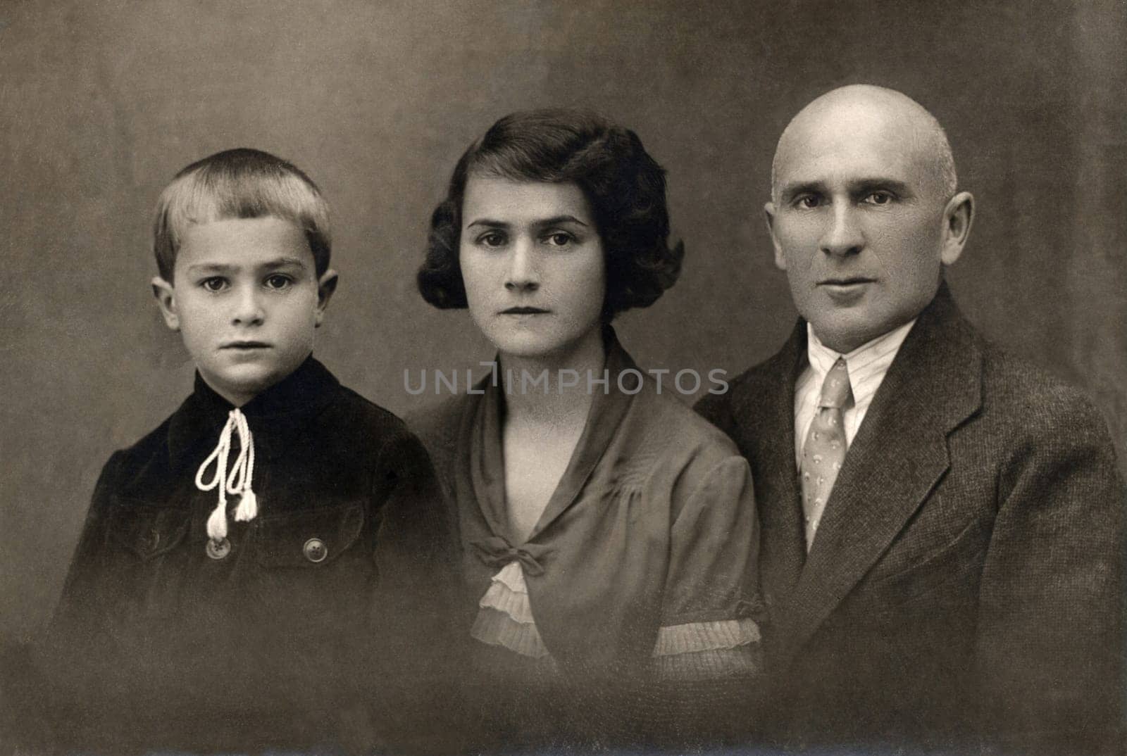 A vintage photo portrait from 1930 of Russian family.
