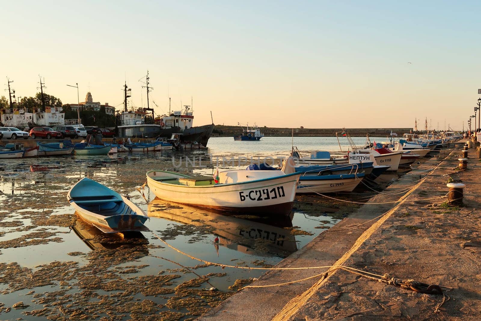 Many small fisherboats tied up in the harbor, port next to the old town of Sozopol, Sosopol, Bulgaria, 4th of July 2022
