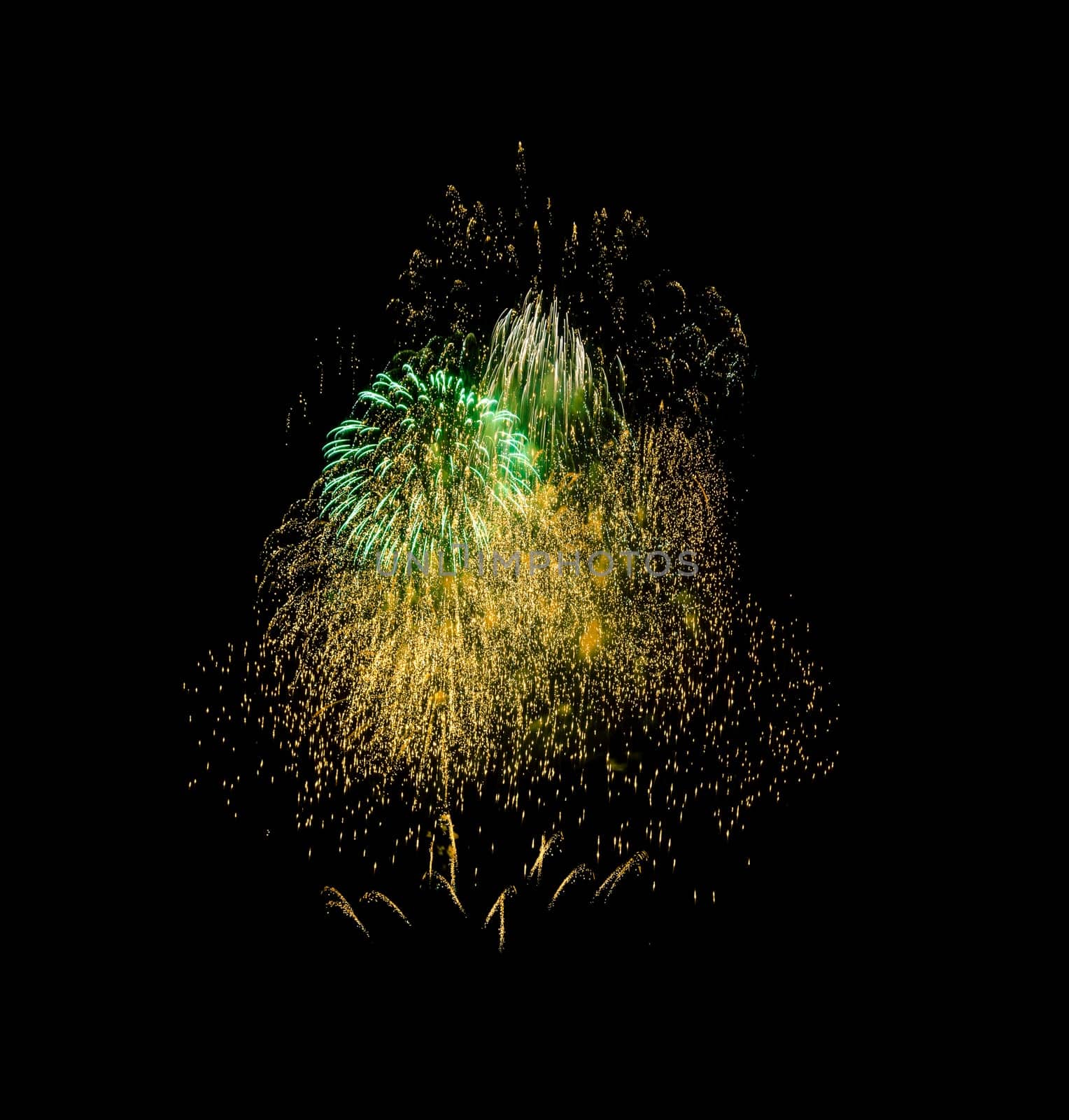 Colorful fireworks exploding in the night sky, isolated on black background. New year and anniversary concept.