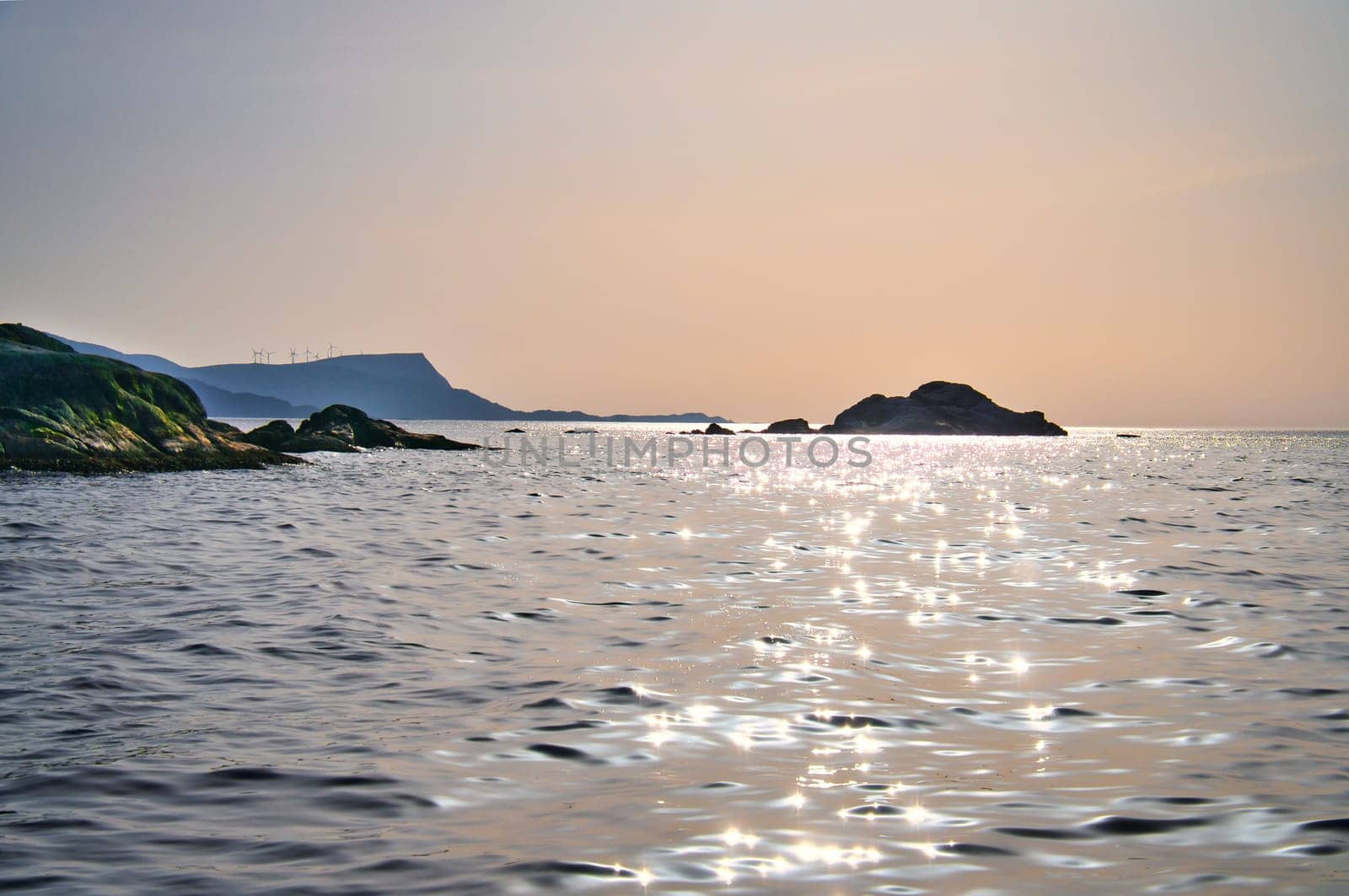Norwegian fjord landscape. View of the open sea on the Western Cape. Crystal clear water, glistening in the sunshine. Landscape from Scandinavia