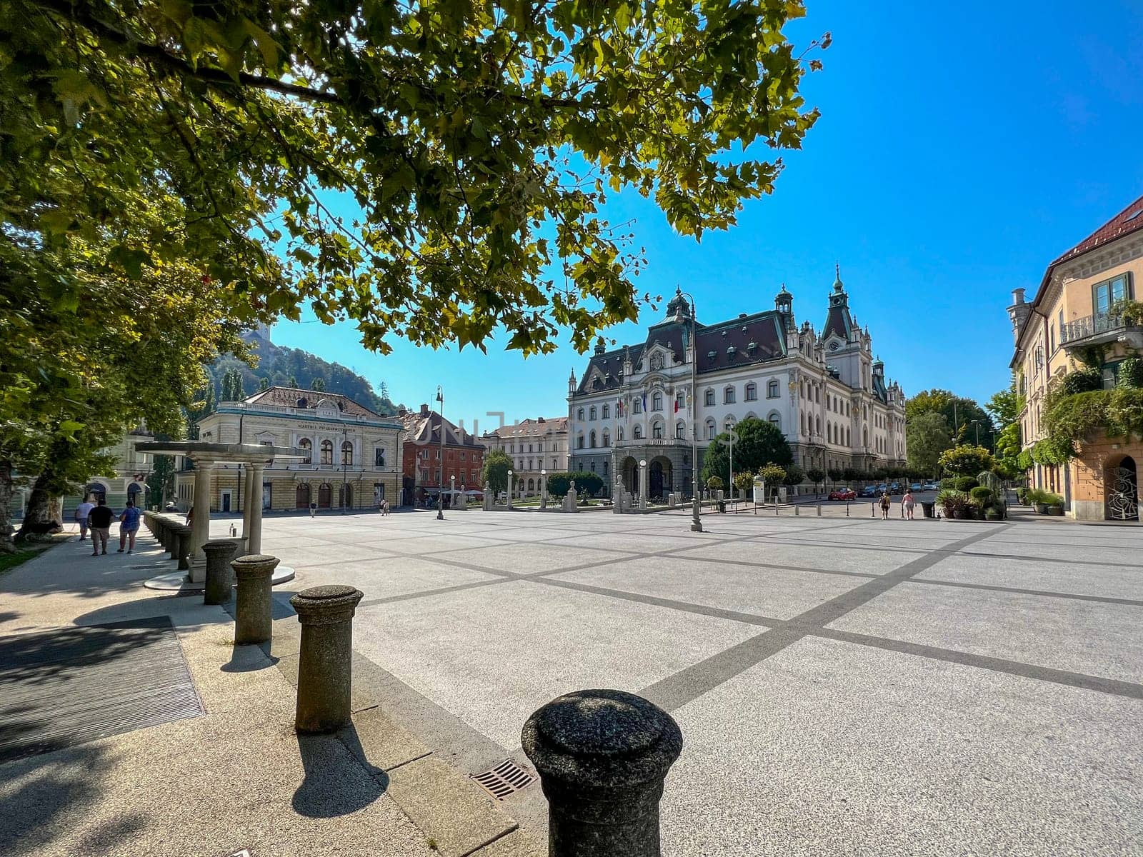 Ljublanja, Slovenia. August 15, 2023. View of a Congress Square (Kongresni Trg) and building of University on a sunny day. The historical centre of Ljubljana, capital of Slovenia