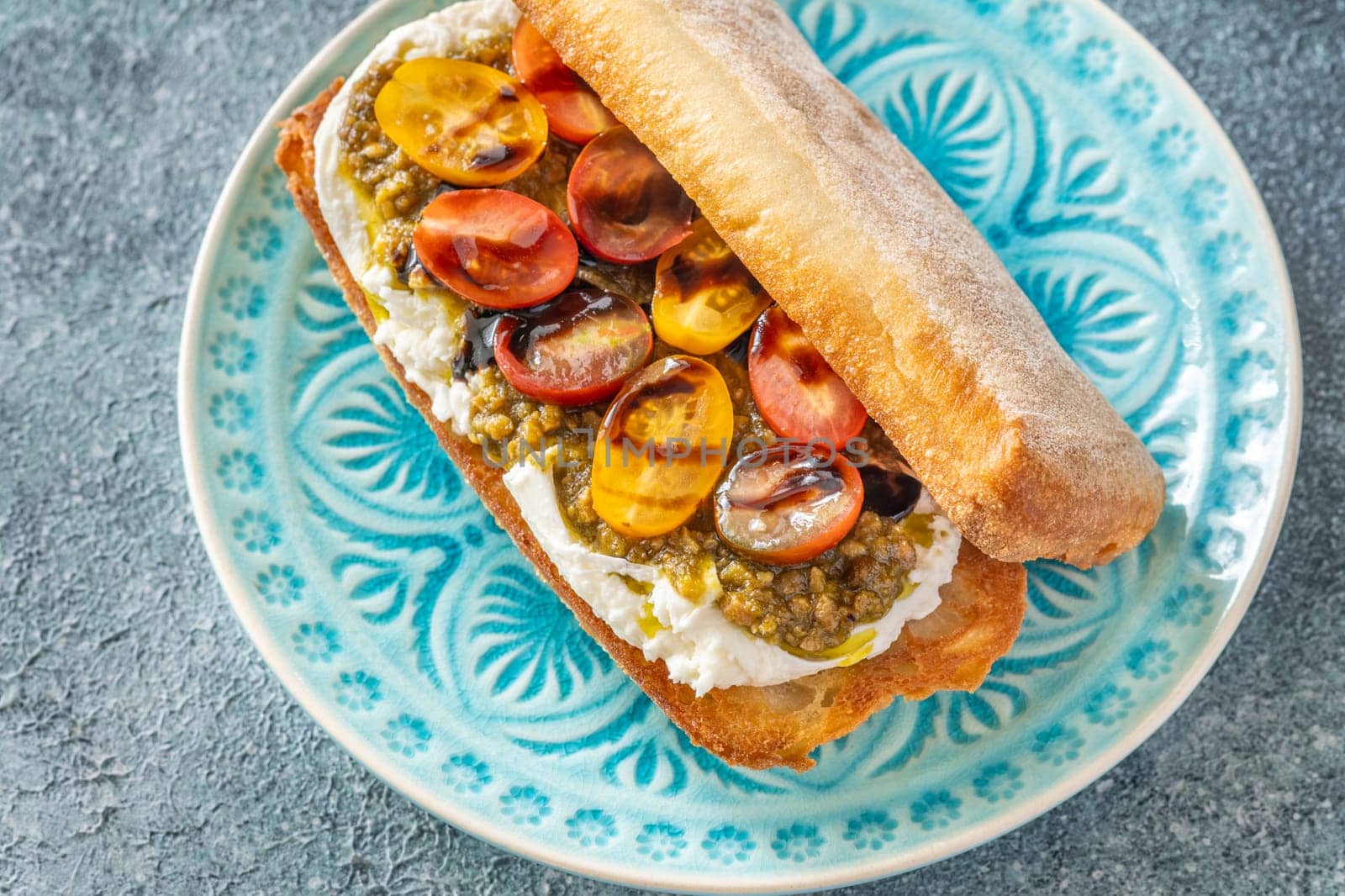 Bruschetta with burrata cheese, pesto and tomatoes