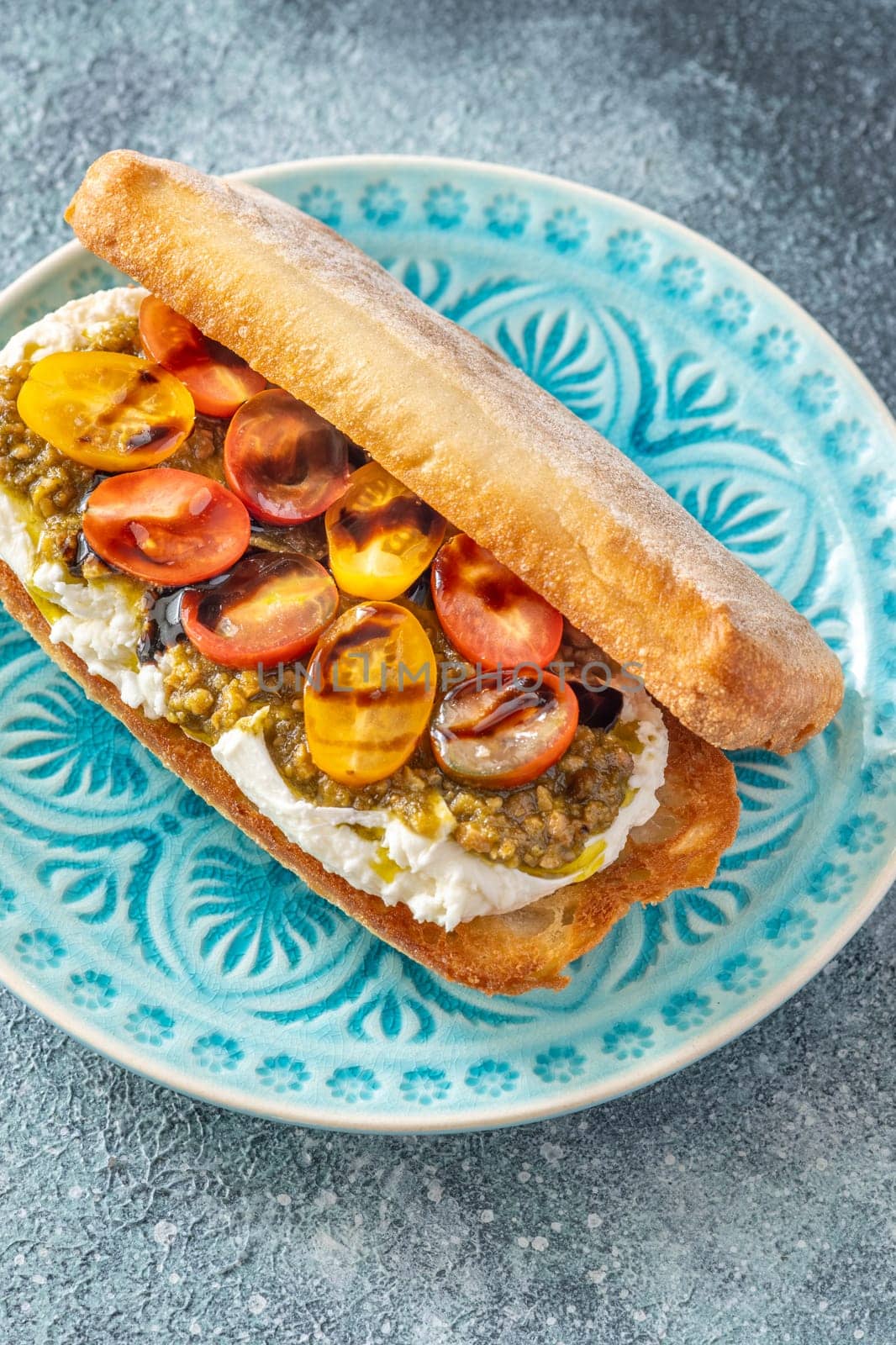 Bruschetta with burrata cheese, pesto and tomatoes
