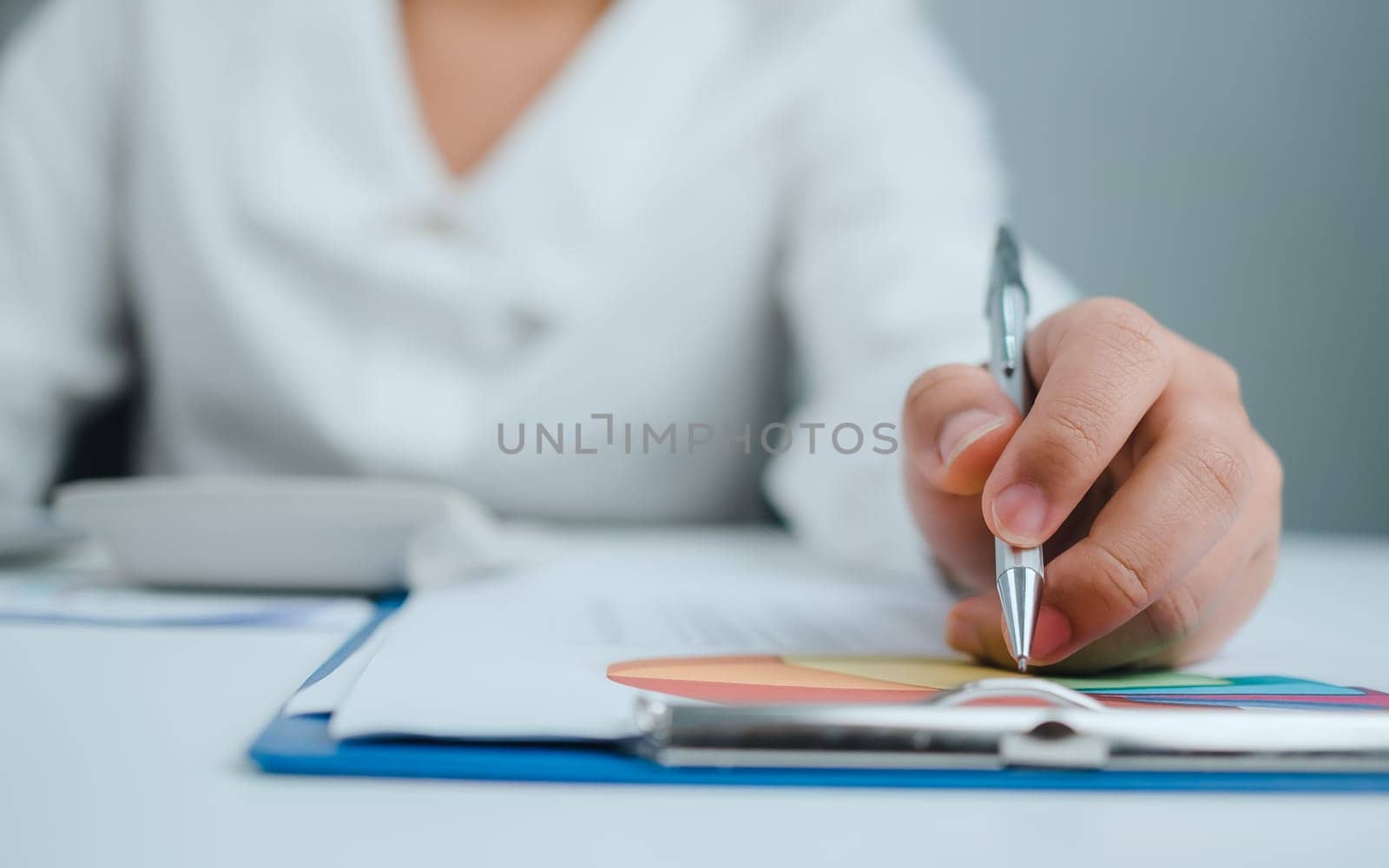 Business woman people use computers and paper documents to analyze business and manage corporate information. Business analysis with charts, indicators, and KPIs to improve organizational performance.