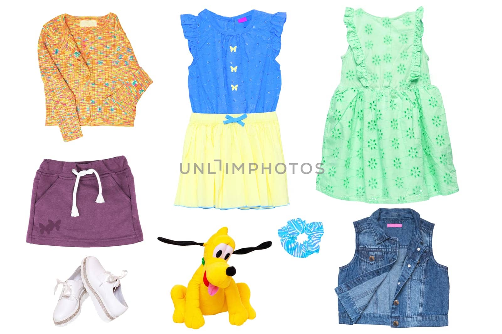 Collage set of little girl summer clothes isolated on white. Kids apparel collection. Childs fashion clothing outfit. Skirt, shorts, shirt, dresses, jeans jacket, funny toy, sweater, shoes.