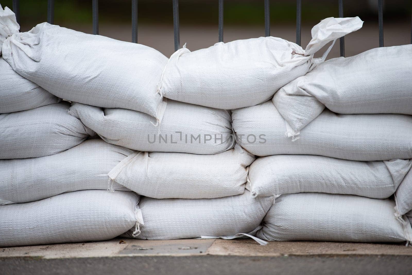 Sandbags for flood defense, river Moselle Trier in Rhineland Palatinate, flooded trees and paths, high water level, climate change