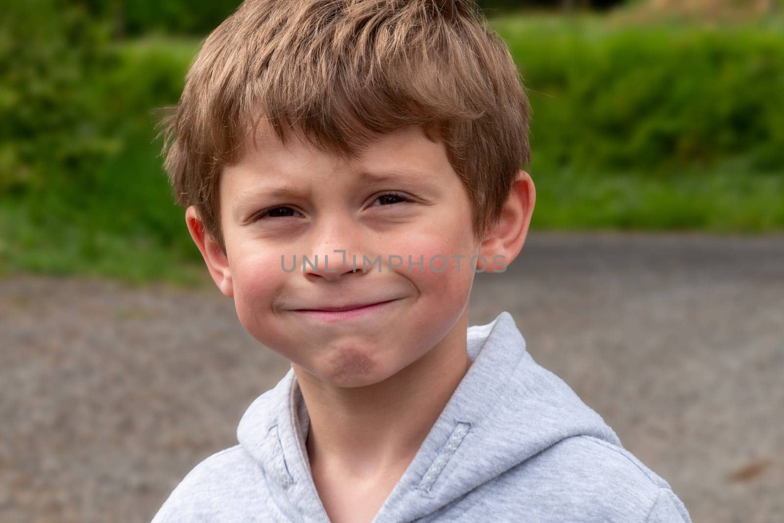 a portrait of a funny little boy