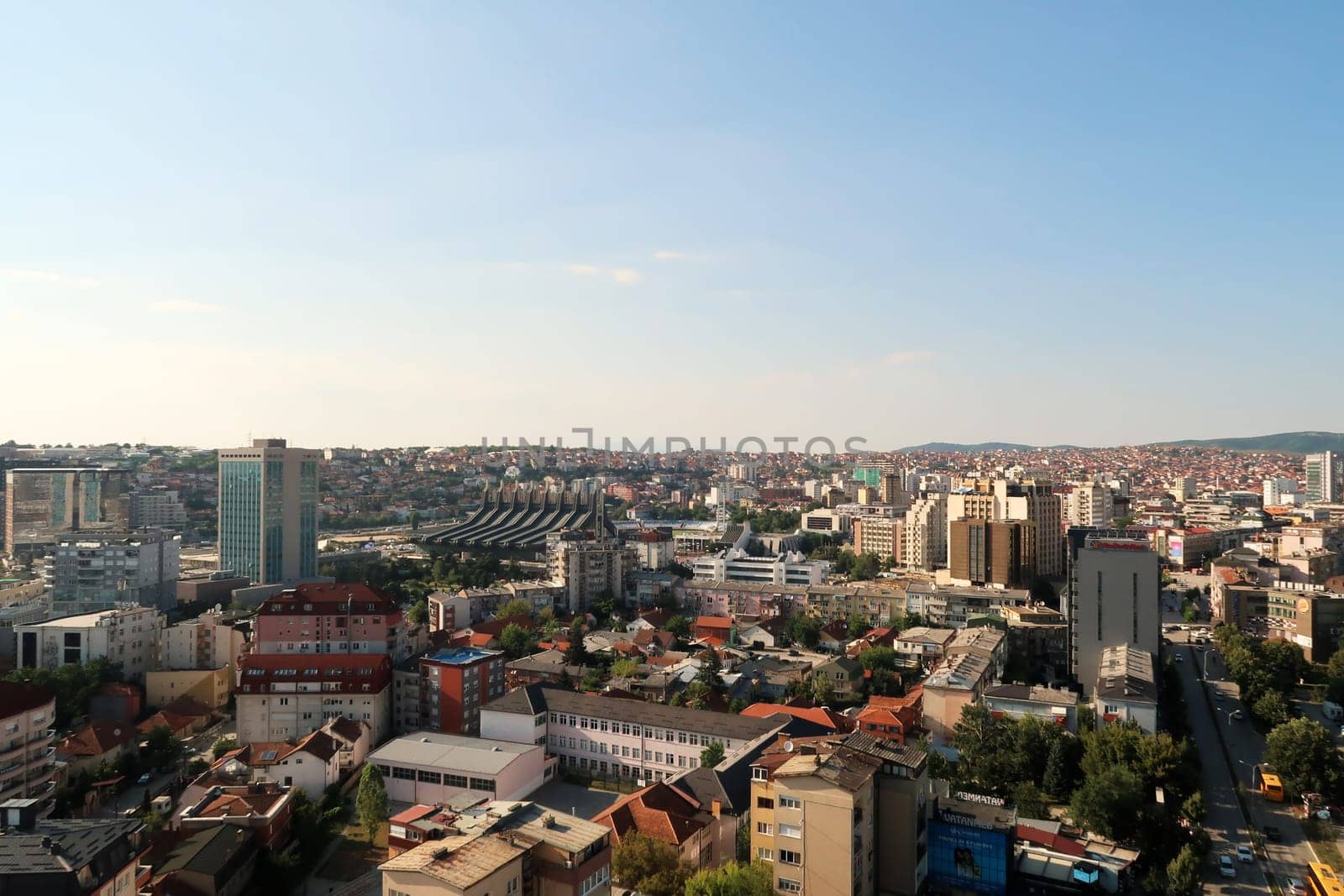 View from the bell, clock tower of the Cathedral of Saint, St. Mother Theresa onto the city center of Prishtina, Pristina, the Palace of Youth and Sports can be seen, Prishtina, Pristina, Kosovo 2022
