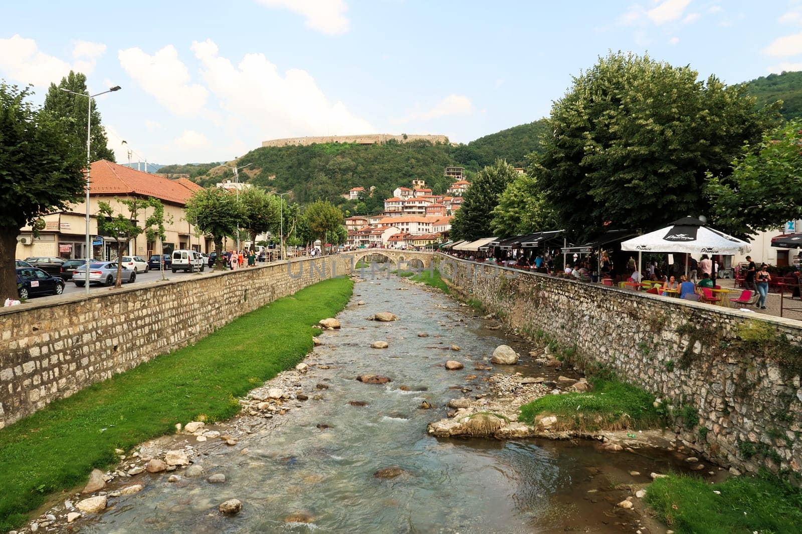 The Prizren Bistrica River running through the busy old town of Prizren, Kosovo 2022