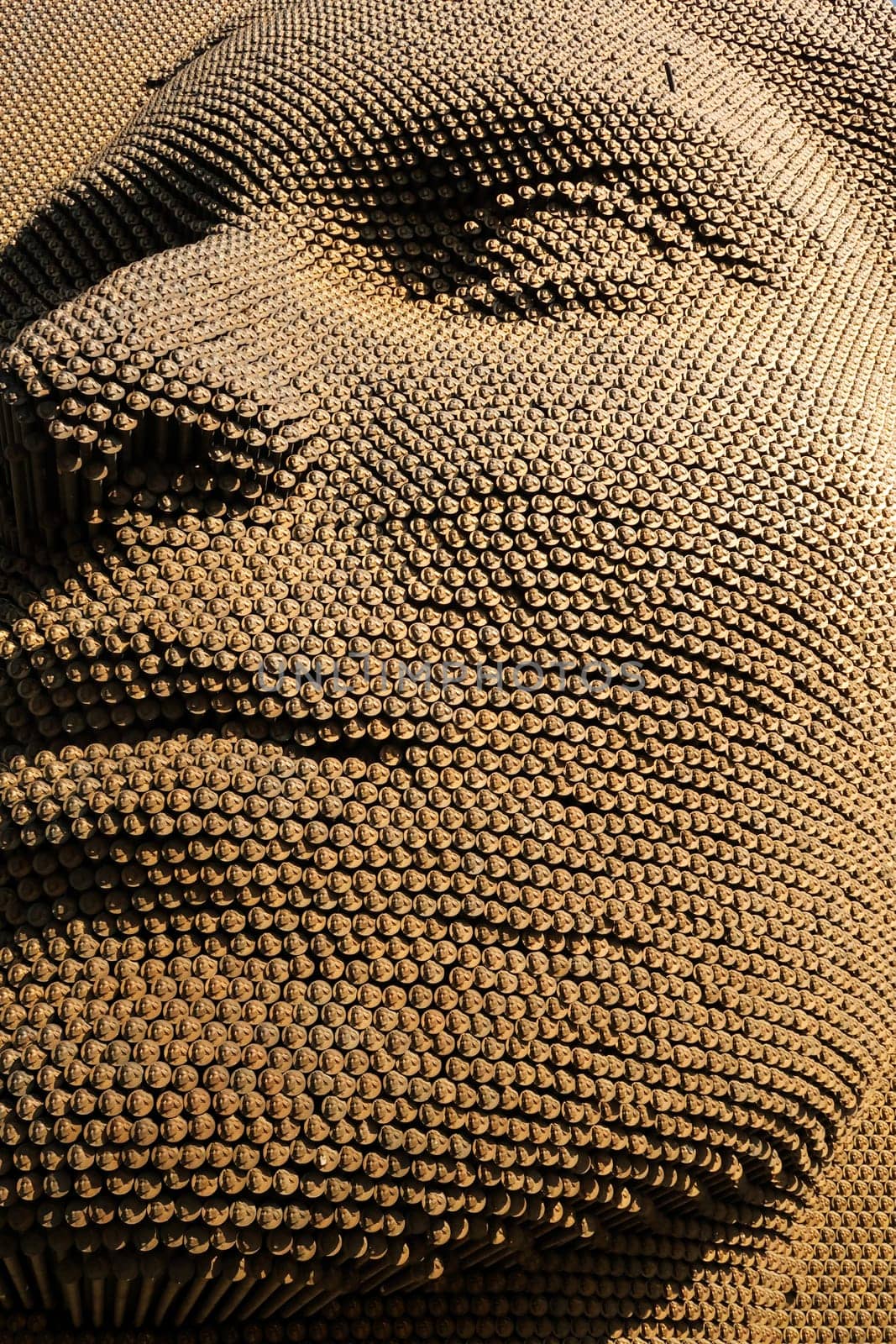 Close look on the pins that form the beautiful womans face of the Heroinat Memorial, a sculpture in the city center of Prishtina, Pristina to commemorate the crimes commited against women in the Kosovo war, Kosovo, 25th of July 2022