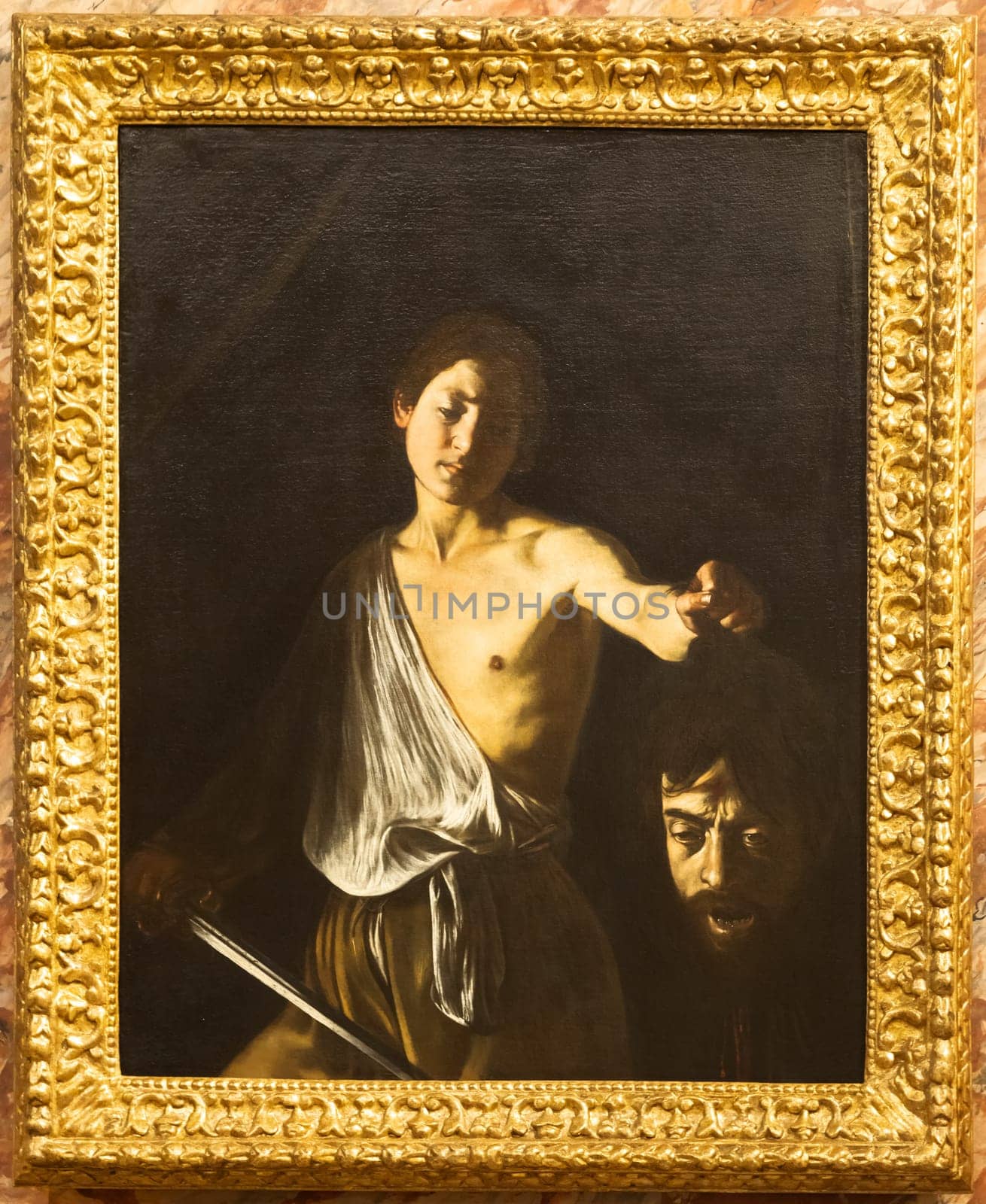 Rome, Italy - 28 December 2023: David with the head of Goliath, by Caravaggio, 1610 - oil on canvas - cm 125 x 101, Galleria Borghese