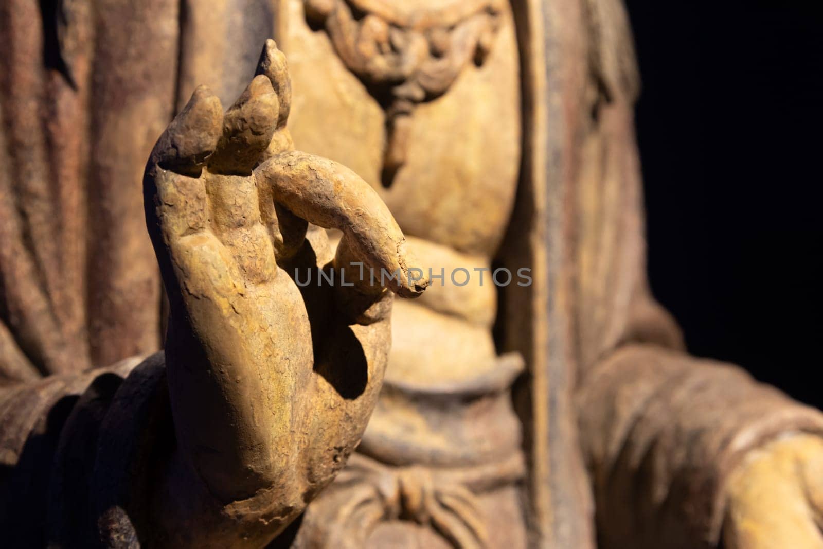 Ancient Buddha hand. Concept of energy, ethnic, harmony, meditation, peace