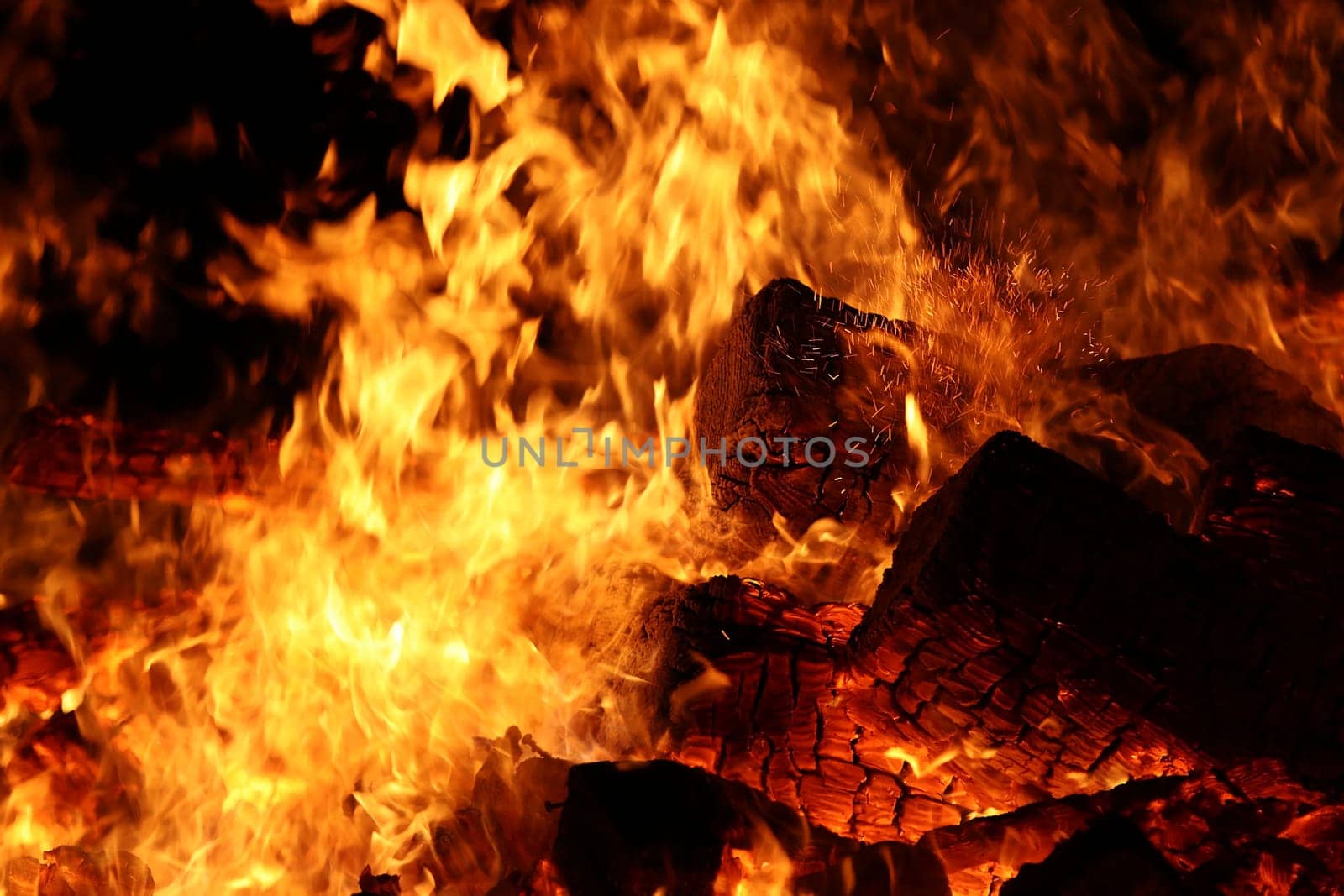 Burning wood with flying sparks