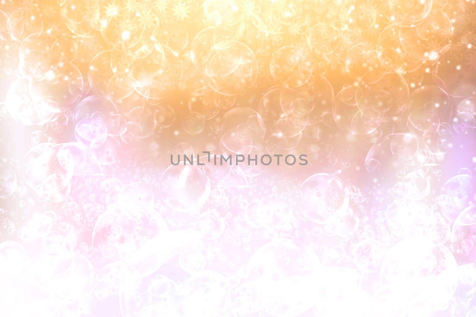A festive abstract light golden yellow pink orange white background texture with defocused bokeh circles. Card concept for Happy New Year, party invitation, valentine or other holidays.