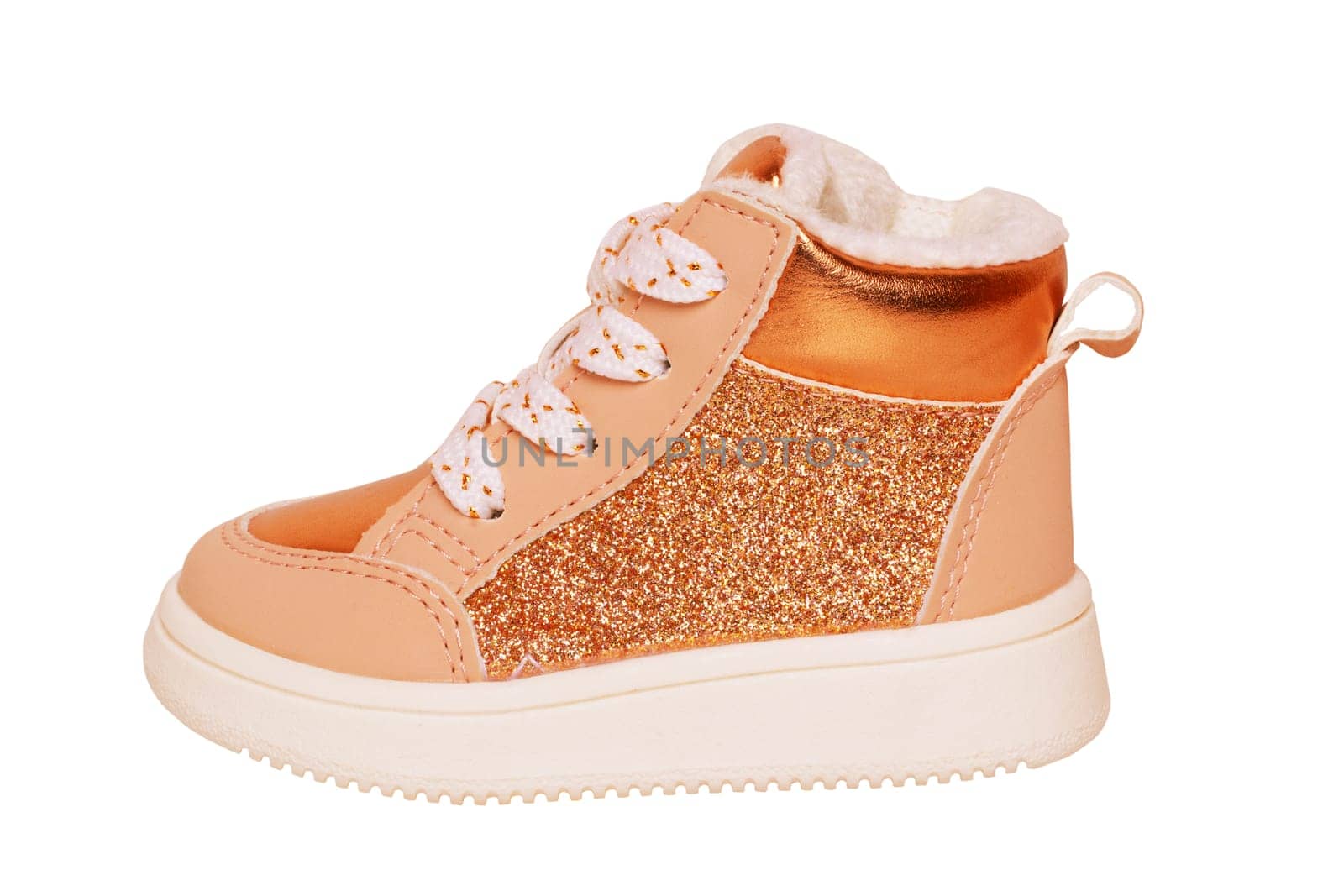 Boots for children. Close-up of a single of elegant brown suede winter boot which are lined with fur. Clipping path. Girls winter shoe fashion isolated on a white background.