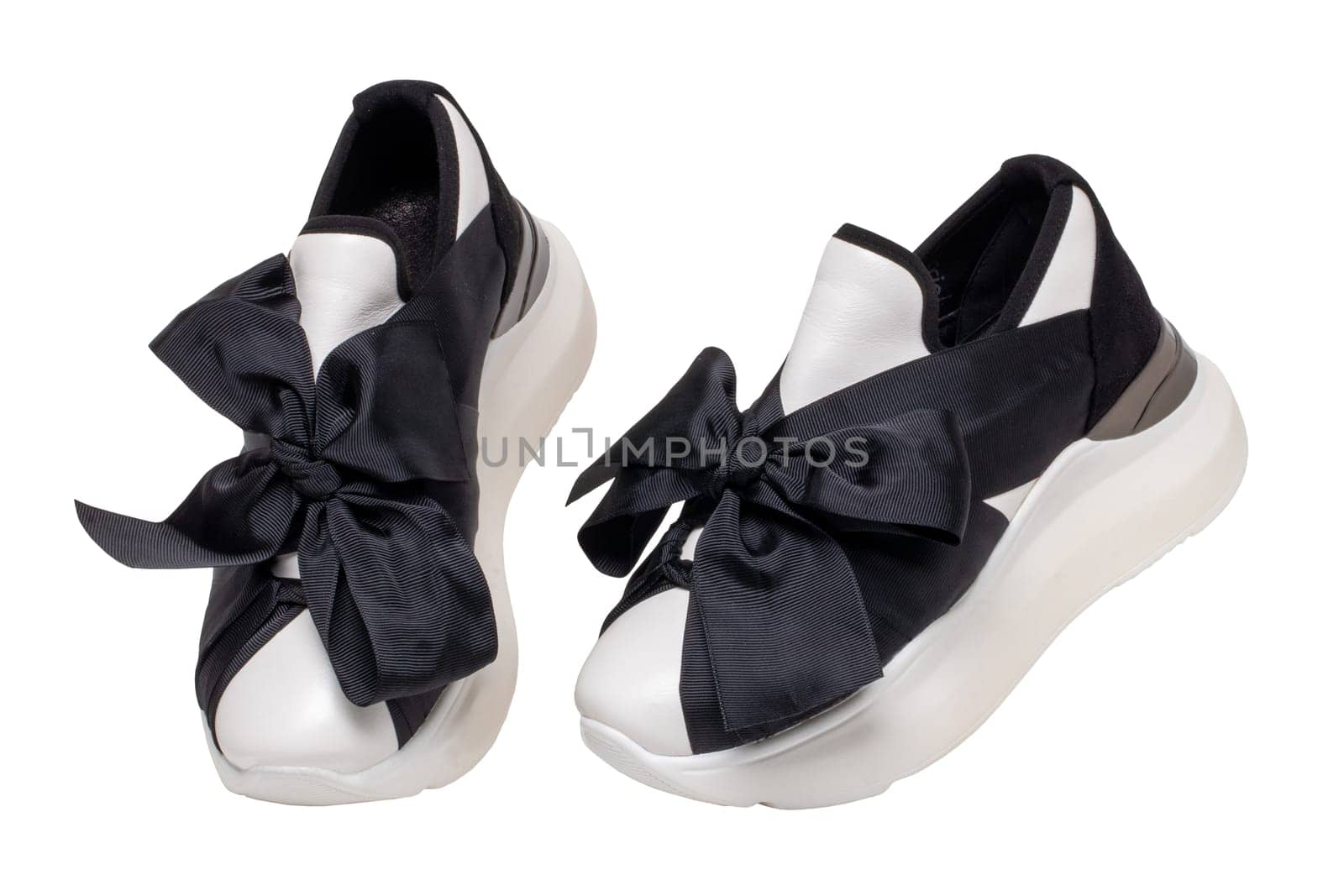 Closeup of a pair black white elegant stylish female leather high-heeled sport shoes isolated. Womens shoe fashion. Modern design footwear for workout.