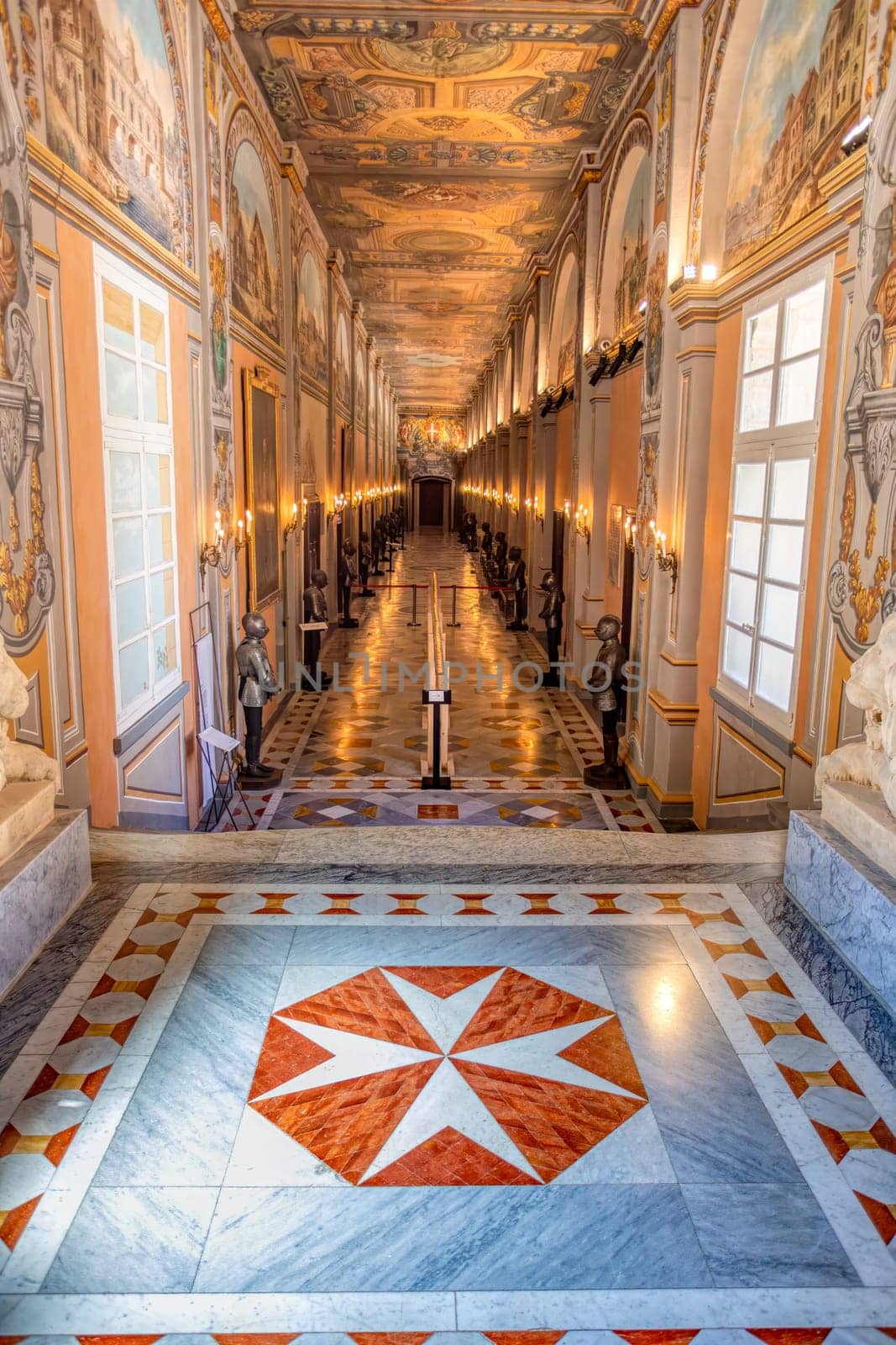 Interior of historic Grandmaster's Palace hall with impressive architectural details and traditional Maltese painting in Valletta. Cultural heritage of Malta