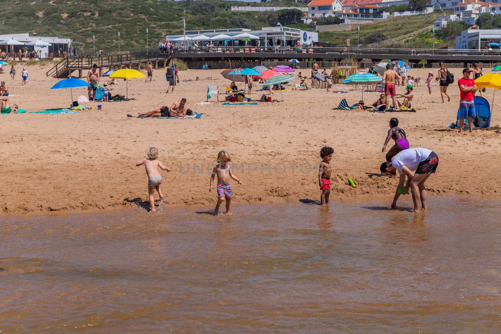 Sintra, Portugal: April 13, 2024: People at the beach of Foz do Lizandro, Ericeira, Portugal