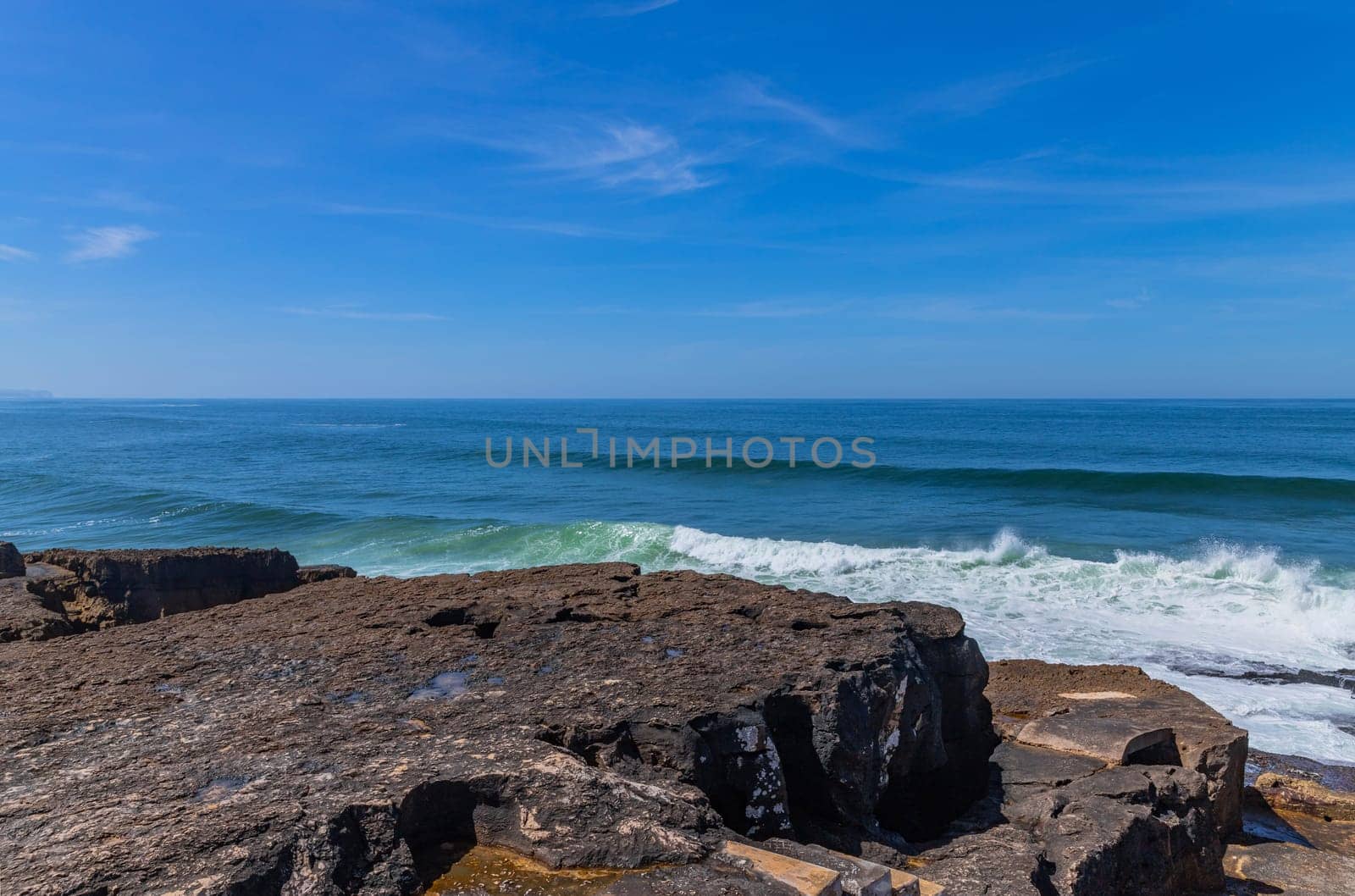 View of ocean waves and fantastic rocky coast in Ericeira, near Lisbon. Portugal