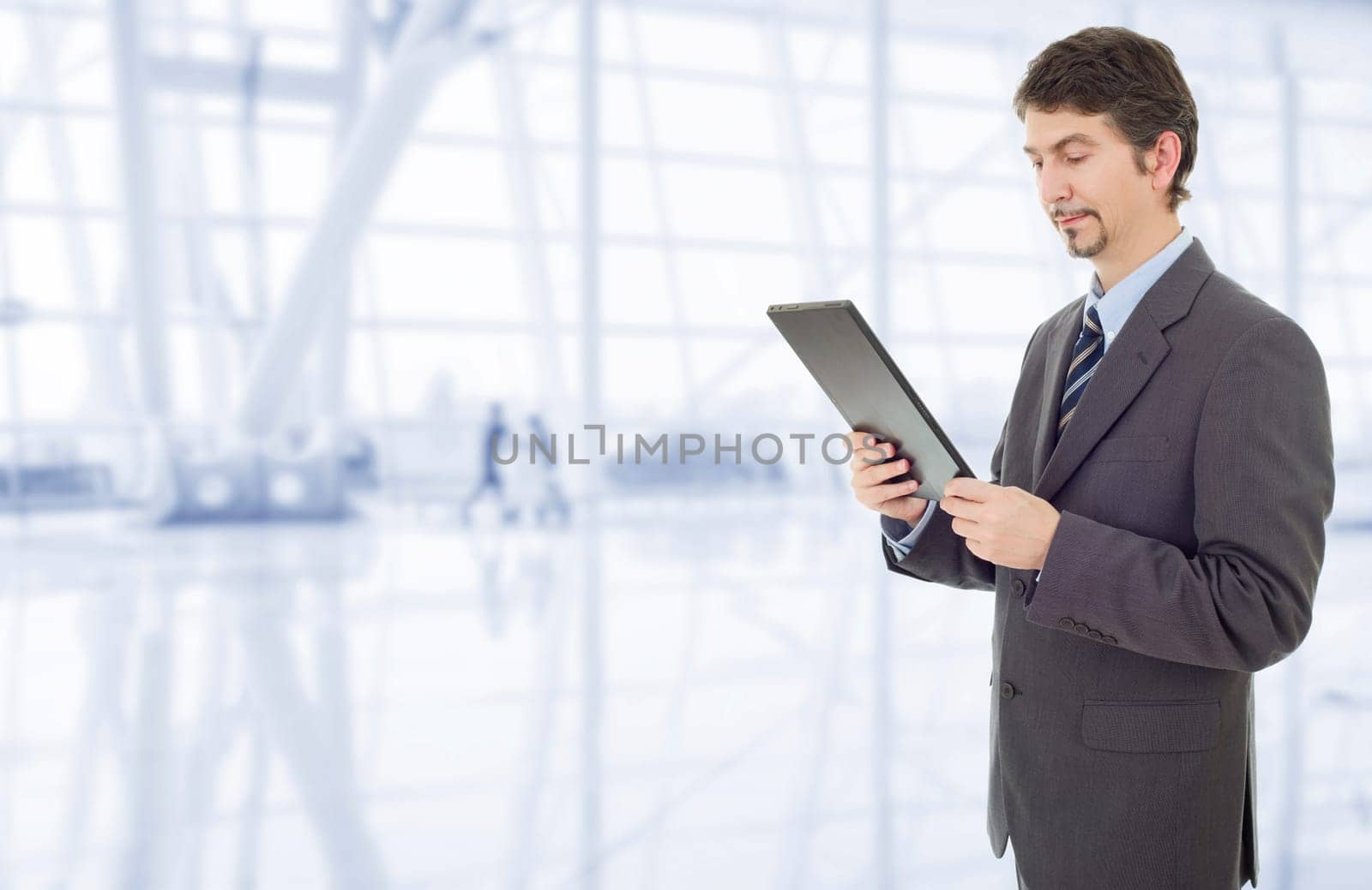 businessman using touch pad of tablet pc, at the office