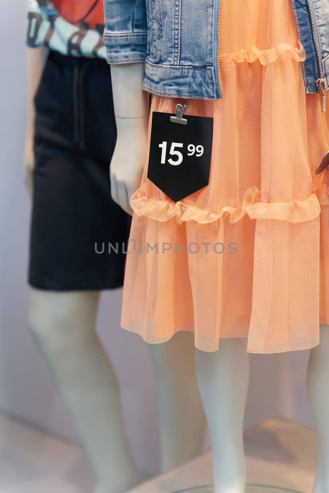 Price tag on a dress in a shop window in the old town of Bruges in Belgium