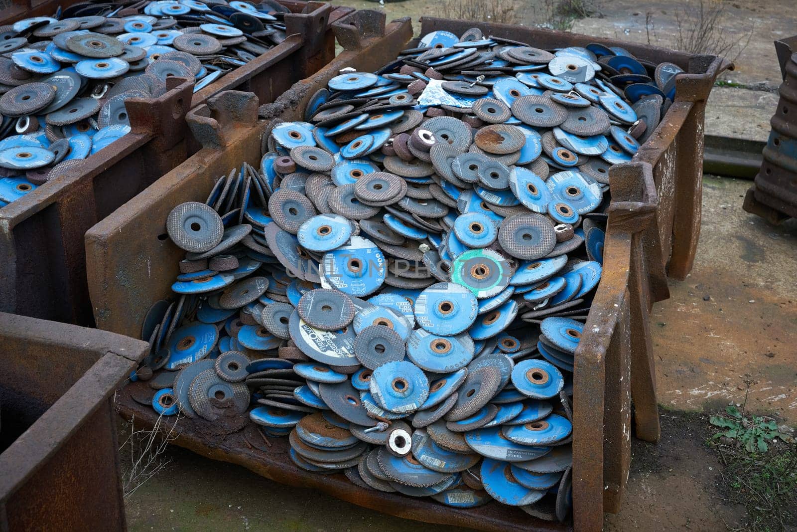 Worn, disused cutting-off wheels for metalworking on the site of an abandoned factory in Magdeburg, Germany
