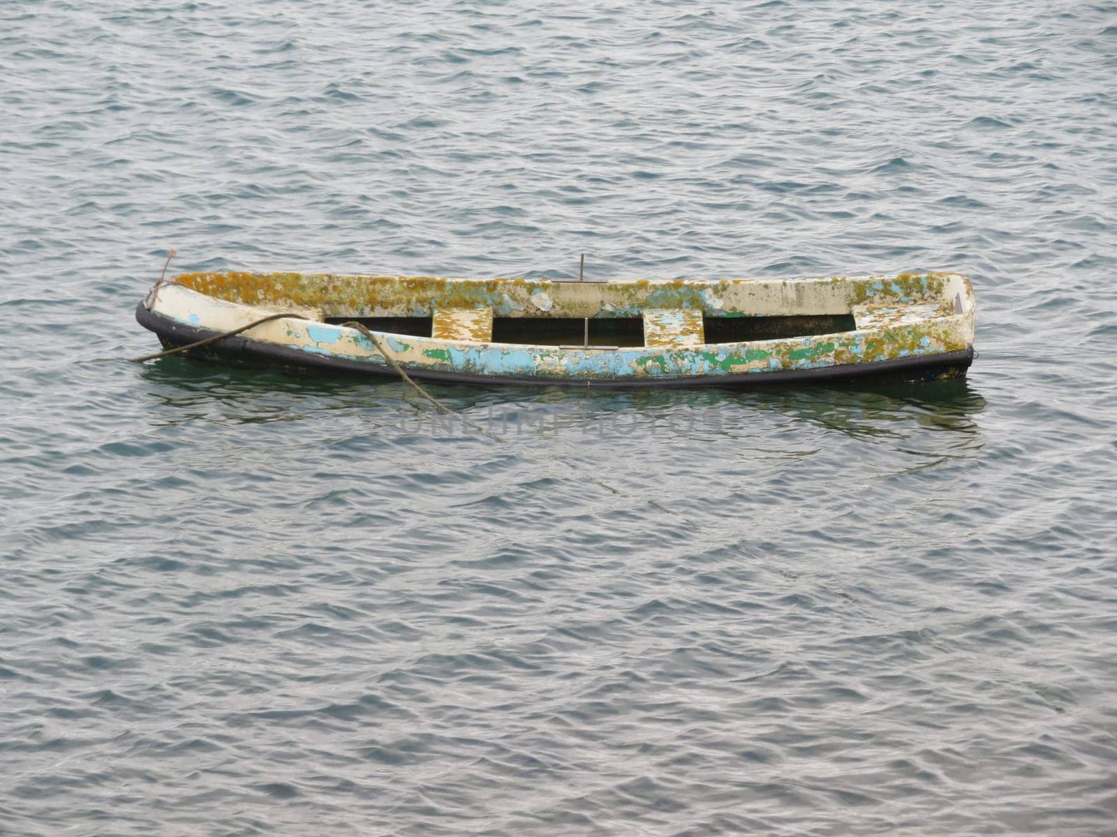 old sunken boat deteriorated abandoned wooden float