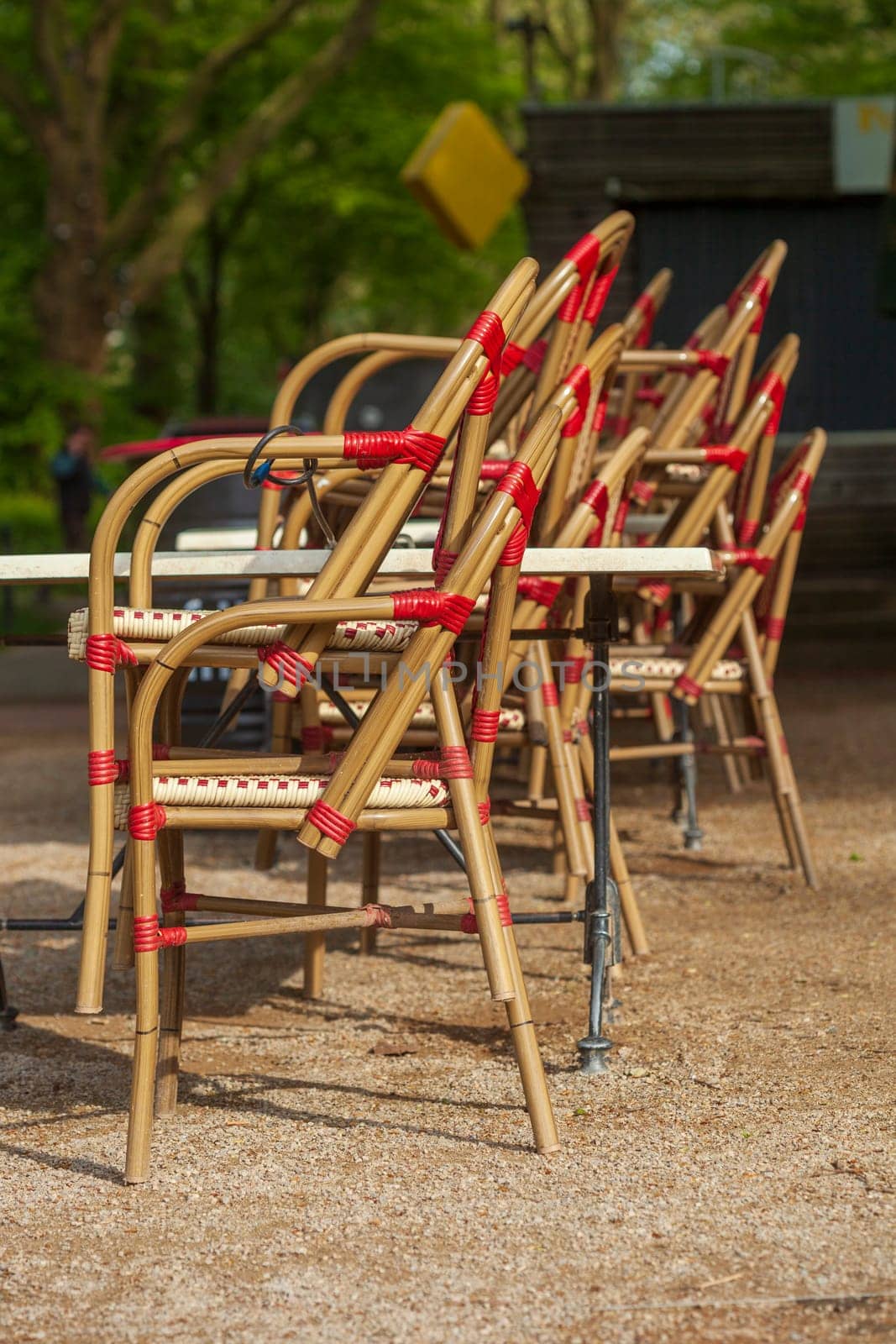 Stacked chairs in front of a restaurant, outdoor catering, Germany