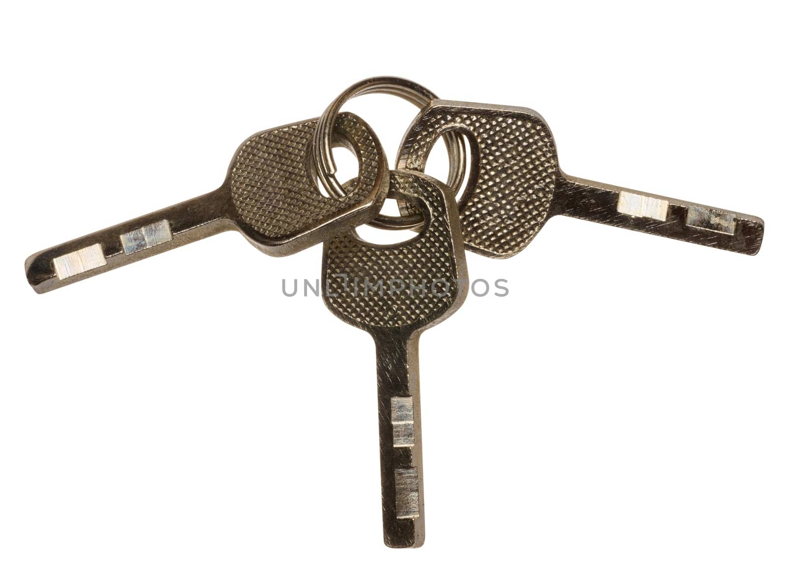 Bunch of three metal keys on isolated background, close up