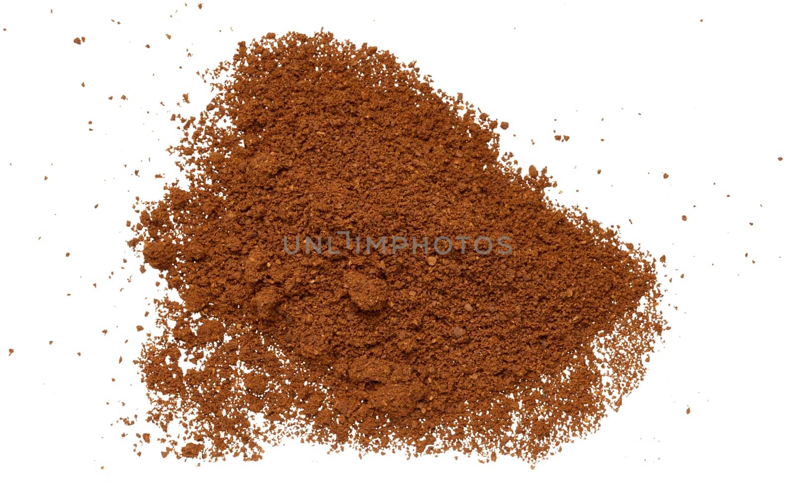 Scattered ground coffee beans on isolated background, top view