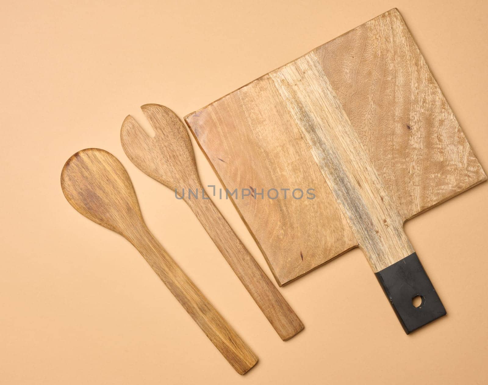 Empty wooden vintage fork and spoon with long handle, top view.