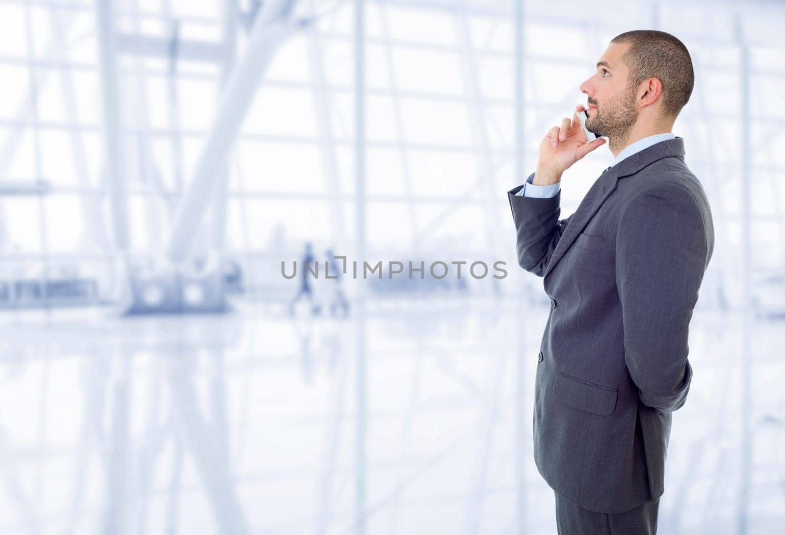 happy business man on the phone, at the office