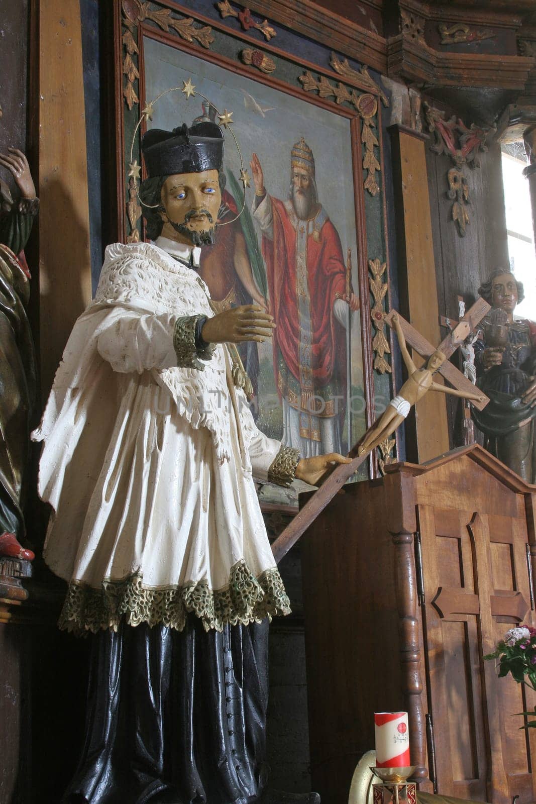 St. John of Nepomuk, statue on the Altar of Saints Fabian and Sebastian in the Parish Church of the Assumption of the Virgin Mary in Gornja Rijeka, Croatia
