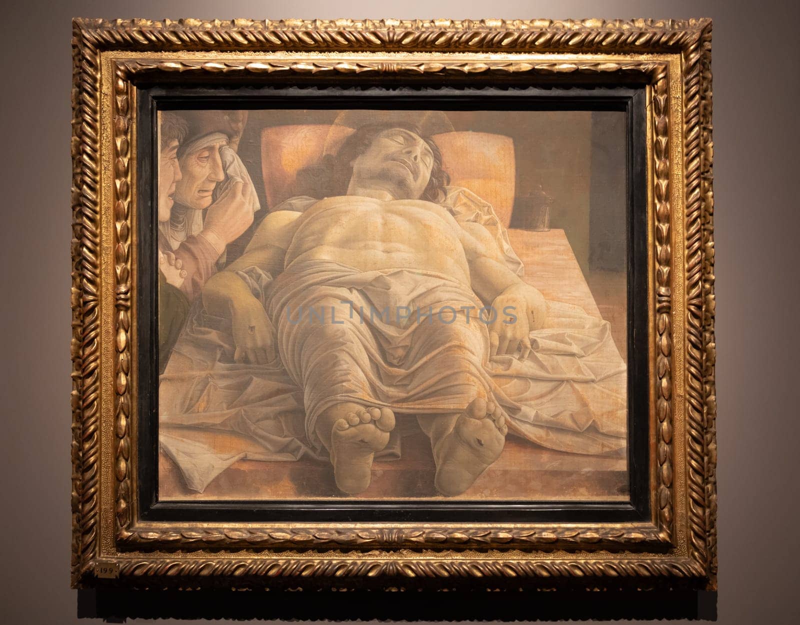 Milan, Italy - 23 September 2023: Brera antique painting museum. Lamentation over the Dead Christ, by Andrea Mantegna, 1483