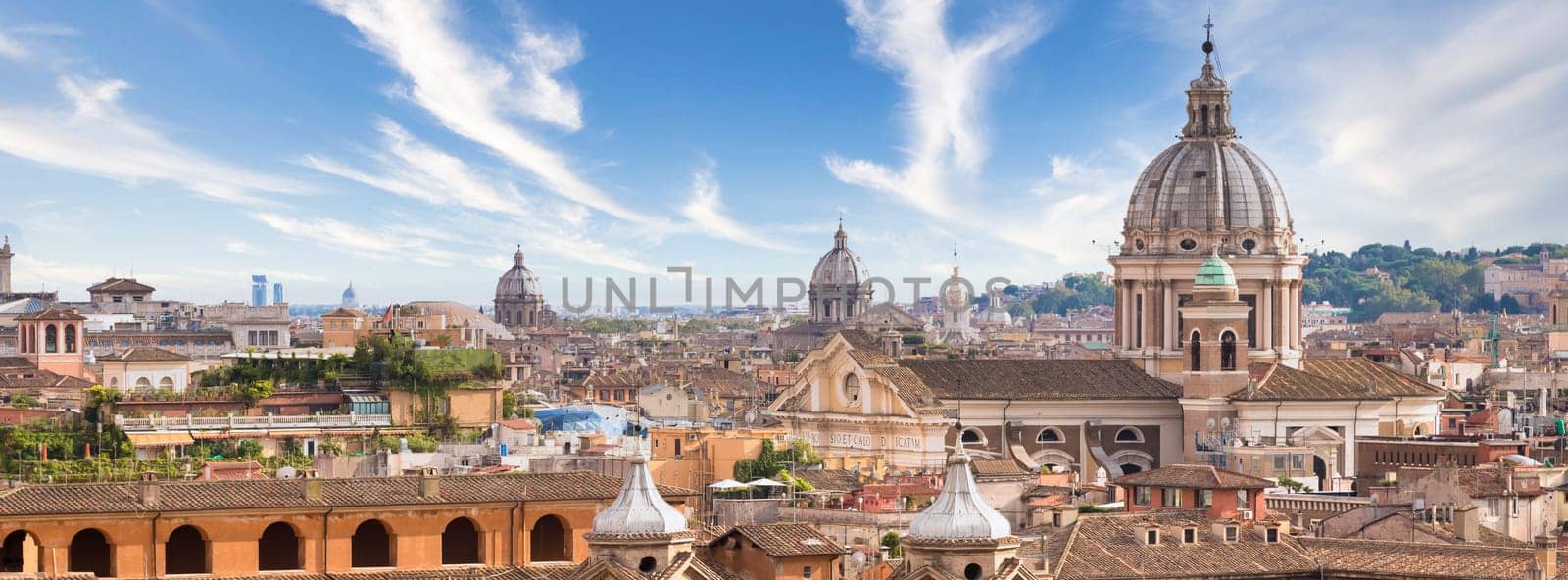 Rome, Italy. Urban landscape, blue sky with clouds, church exterior architecture.