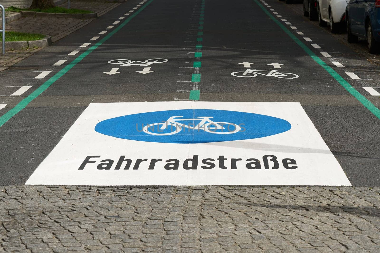 Bicycle lane, Fahrradstraße in the city center of Berlin-Mitte. Cyclists have priority over motorists on cycle lanes.
