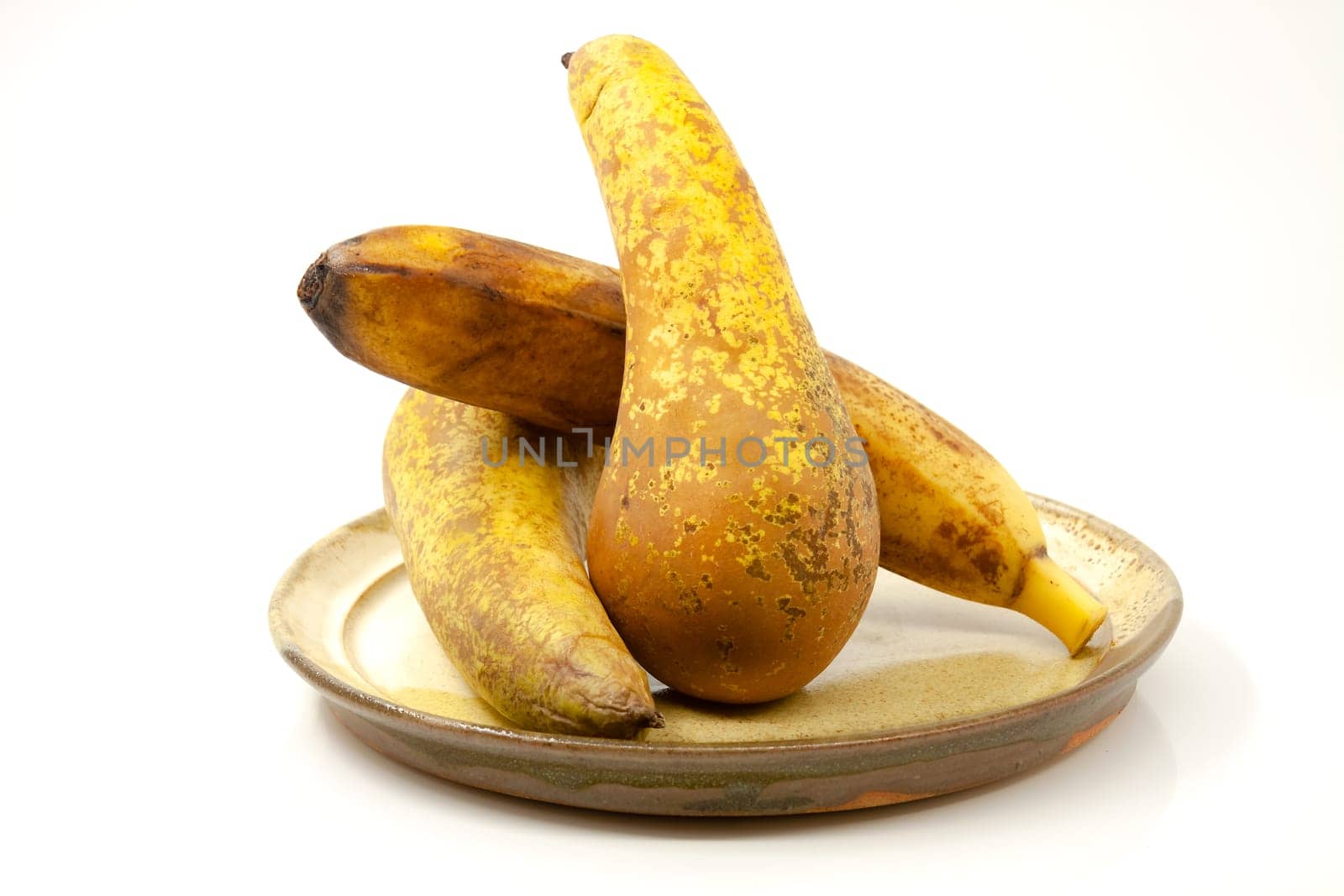 Pears and banana on a ceramic plate