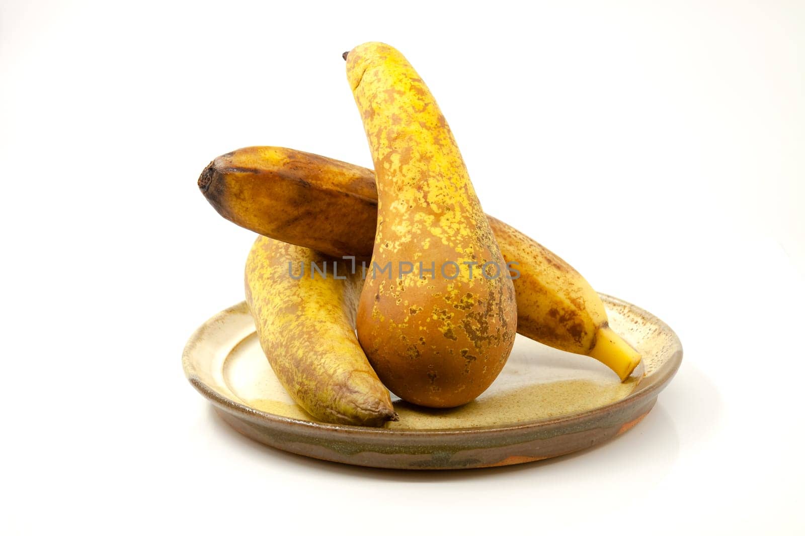Pears and banana on a ceramic plate