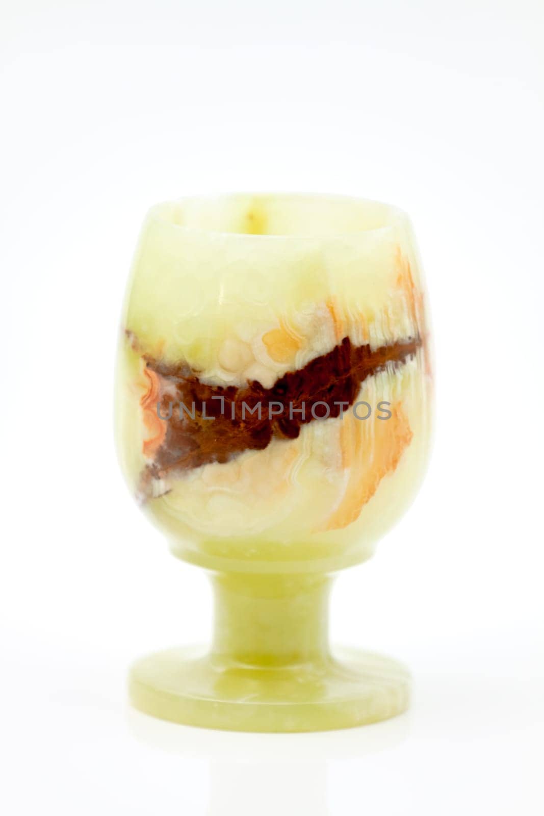 A glass of semi-precious stone onyx with healing and protective forces, according to beliefs. Selective focus with shallow depth of field.
