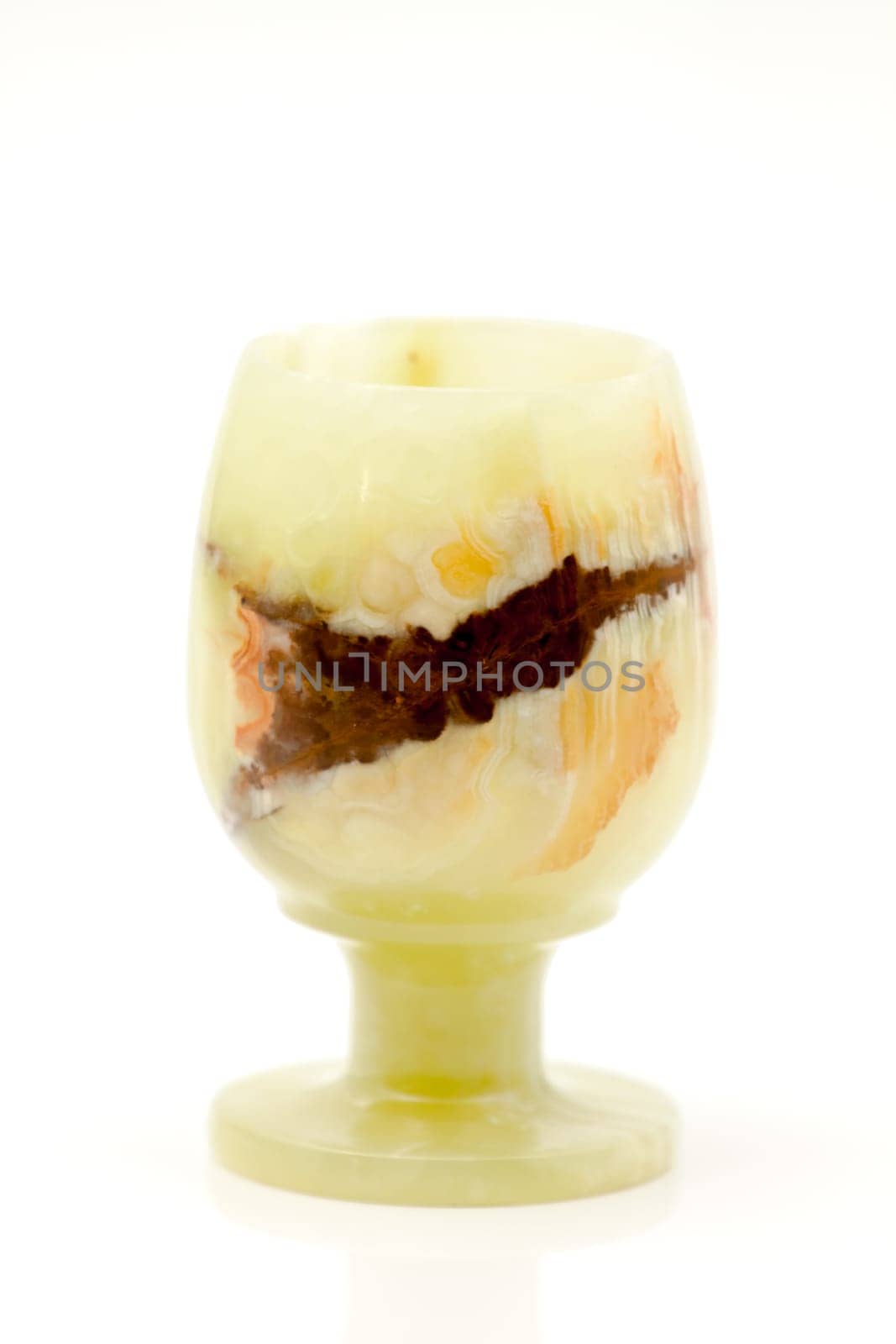 A glass of semi-precious stone onyx with healing and protective forces, according to beliefs. Selective focus with shallow depth of field.