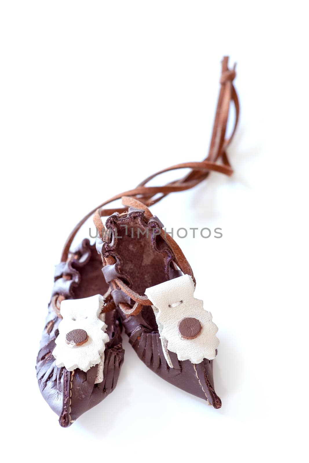 Traditional Bulgarian folk leather shoes - tsarvuli. Selective focus with shallow depth of field.