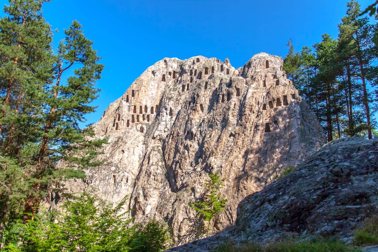 Ardino, Bulgaria - July 9,2021- "Kartal kaya"" rock-cult complex in the southern Rhodopes, dating from the Iron Age.Selective focus with shallow depth of field."