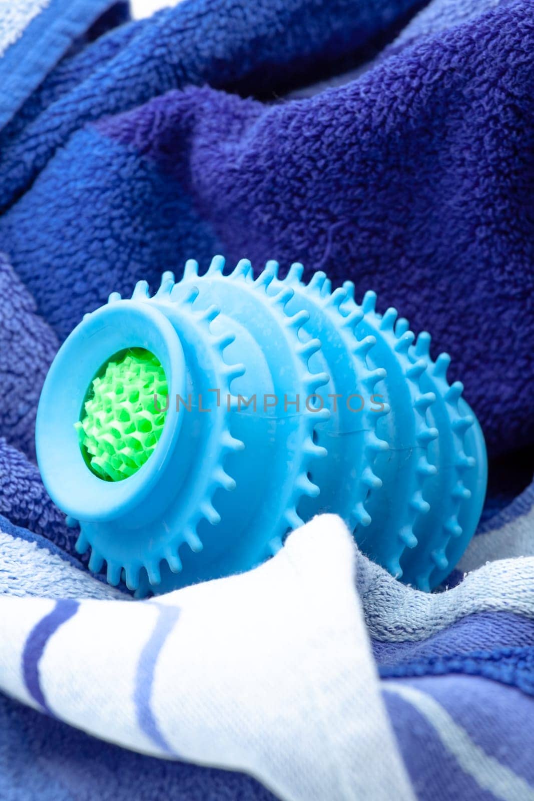 Silicone ball dryer removes moss from clothes and prevents creasing of clothes when drying. Selective focus with shallow depth of field.