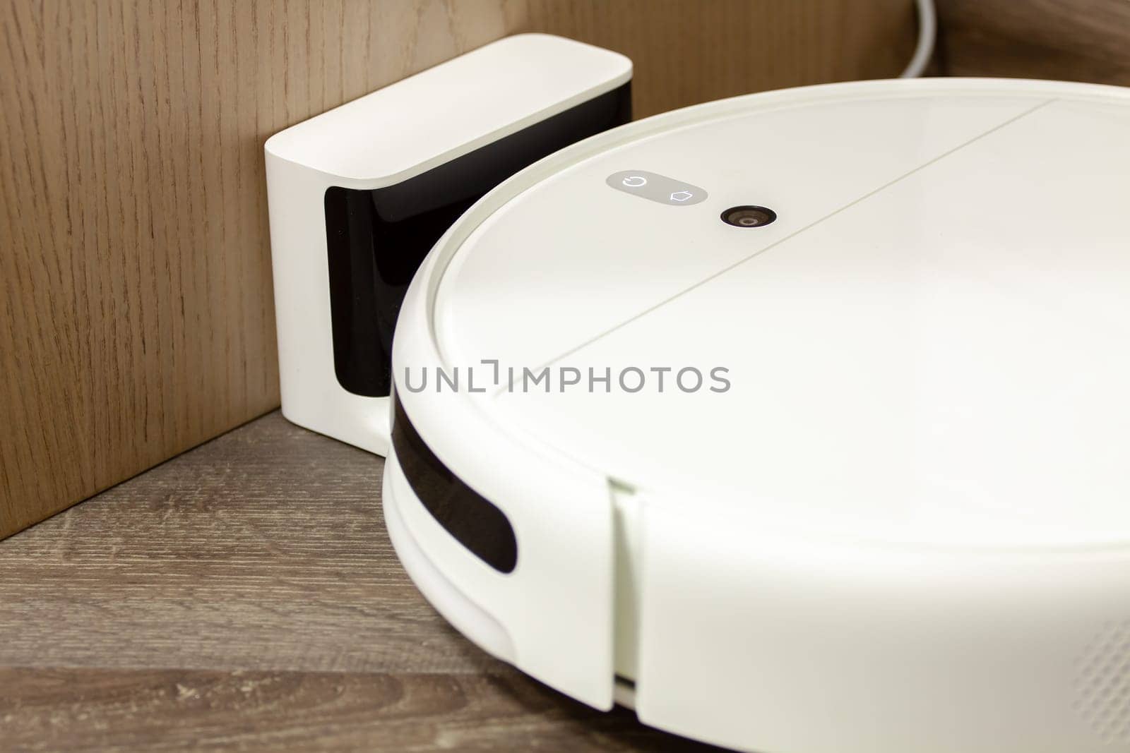 Modern digital home robot vacuum cleaner. Selective focus with shallow depth of field.