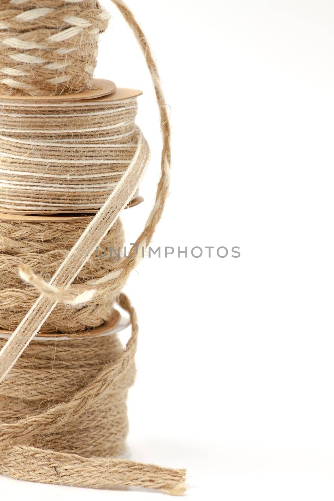 Rolls of braided cord of sackcloth and hemp for decoration and decoration. Selective focus with shallow depth of field.
