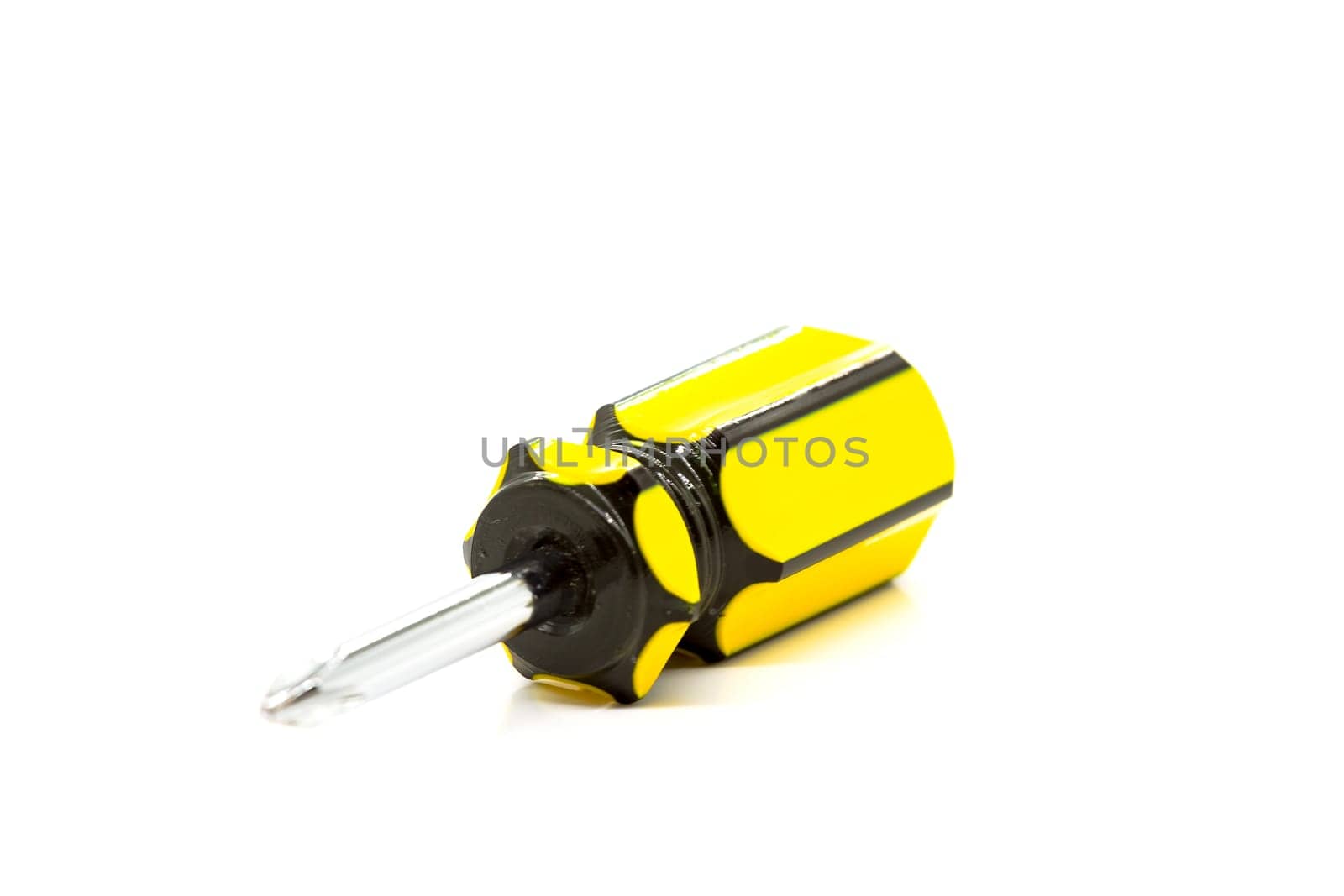 Small screwdriver with a star-shaped tip. Selective focus with shallow depth of field.