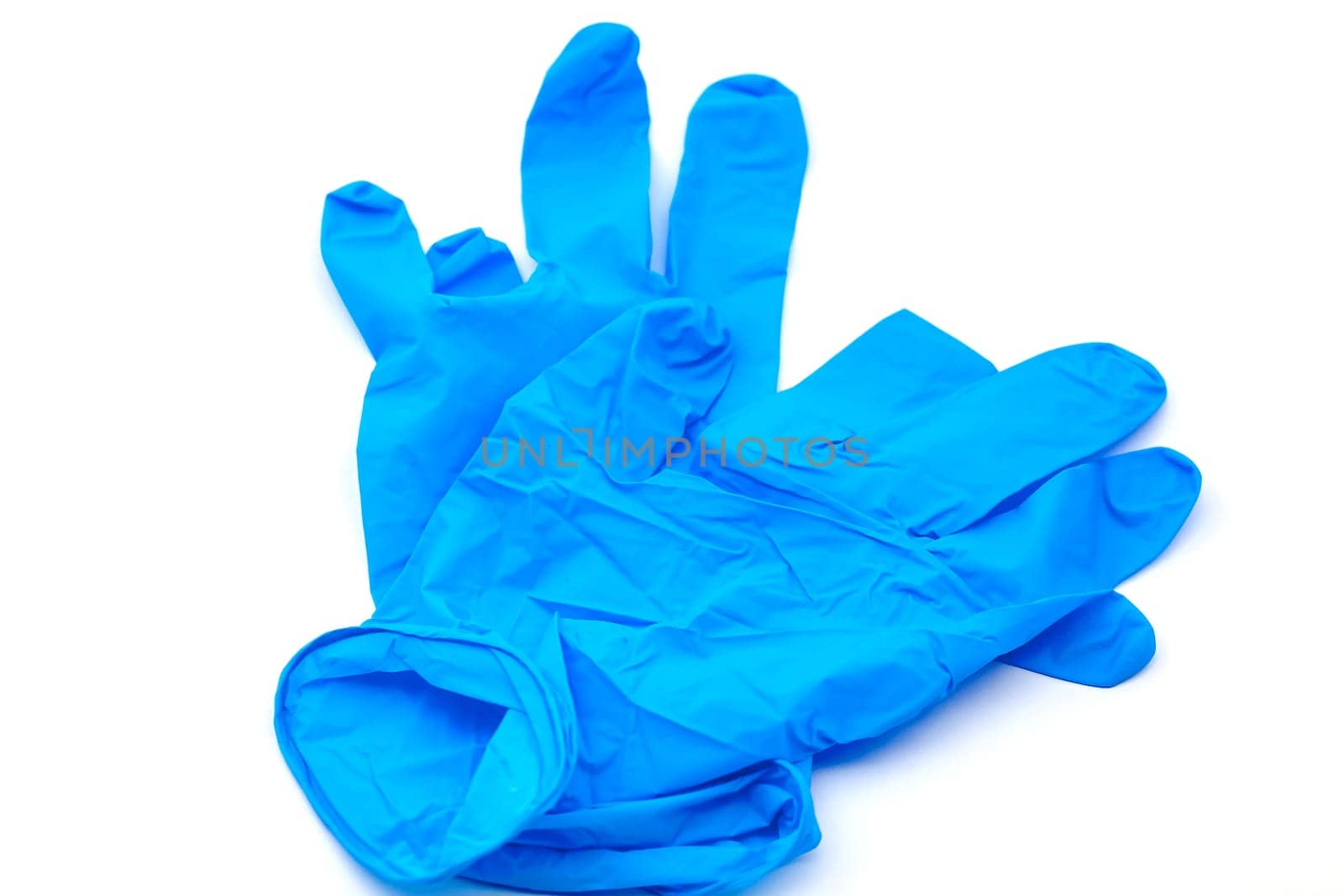 Pair of safety blue latex gloves for hygiene purposes. Selective focus with shallow depth of field.