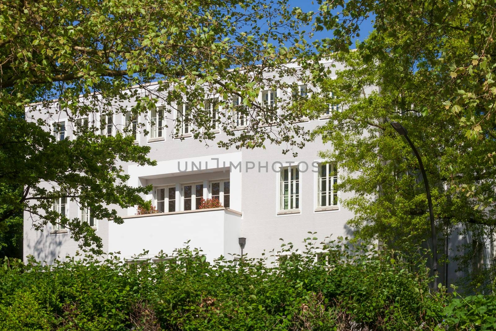 Modern, white residential building in spring, Hamburg, Germany
