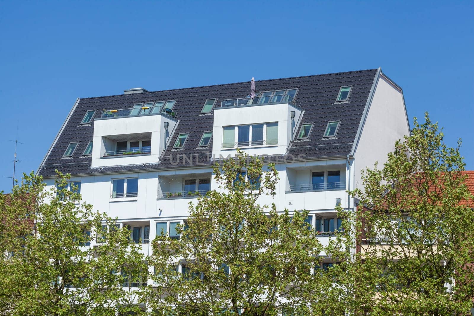 Modern, white residential building in spring, Hamburg, Germany