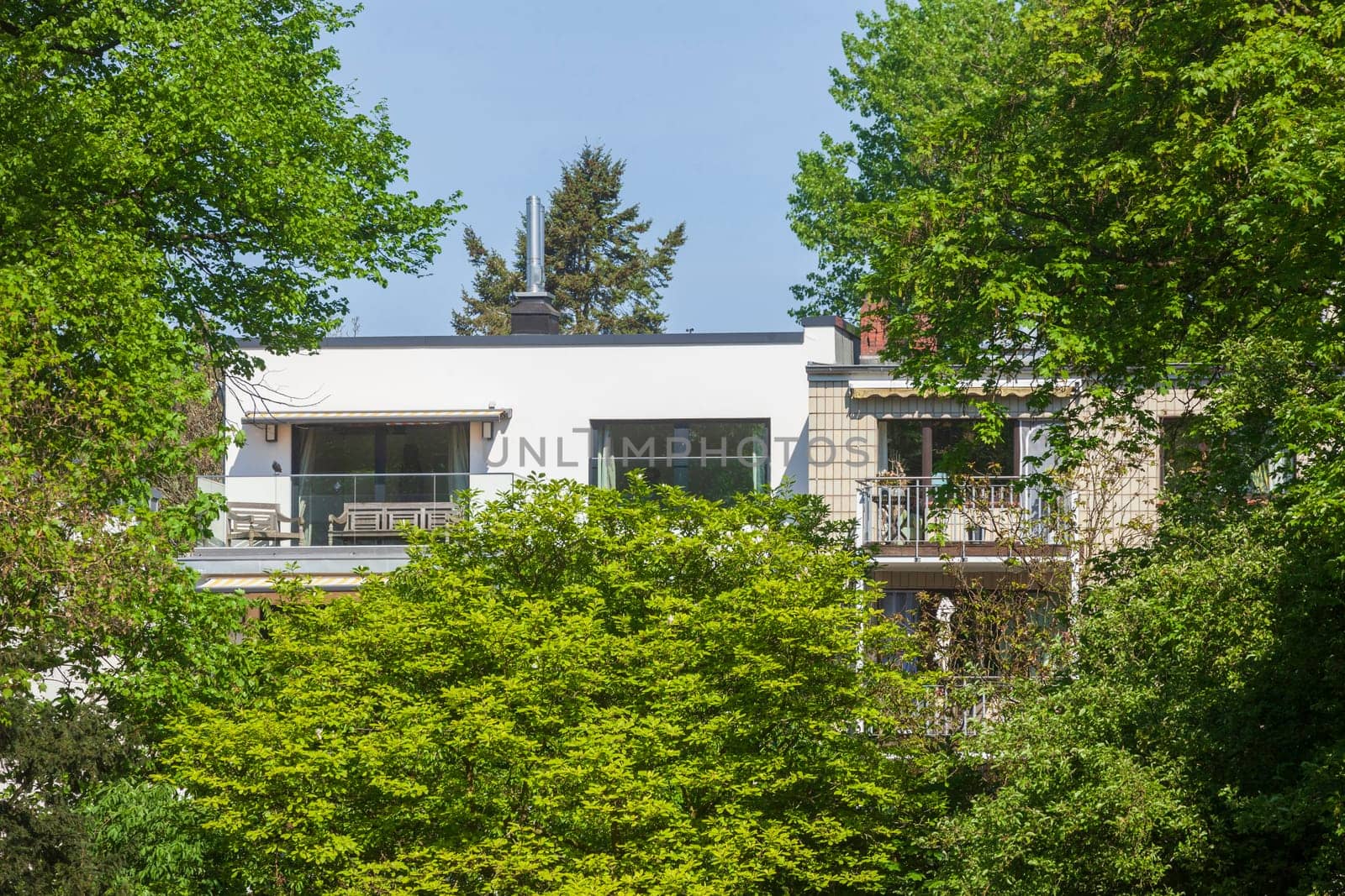 Modern, white residential building in spring, Hamburg, Germany